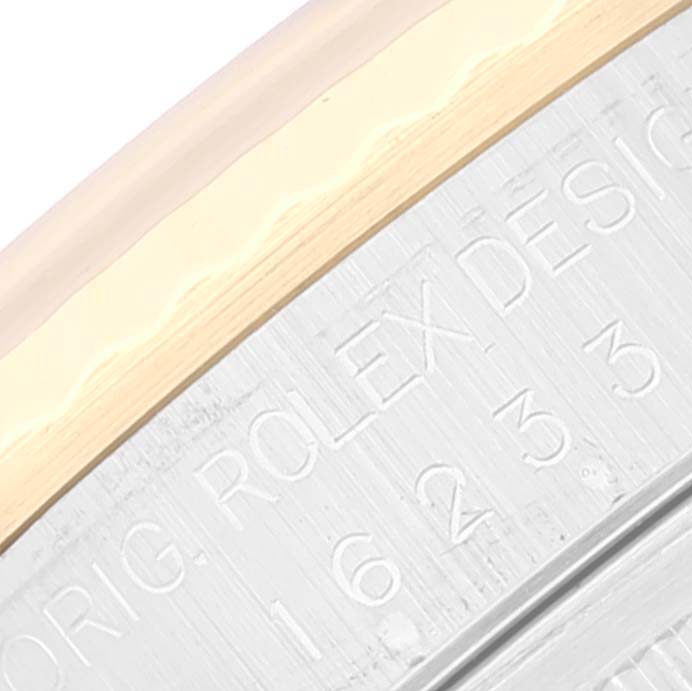 This image shows a close-up of the case back engravings of a Rolex Datejust 16233 Men's Stainless Steel Beige Dial 16233 Men's Stainless Steel Beige Dial model, highlighting the reference number and brand inscription.