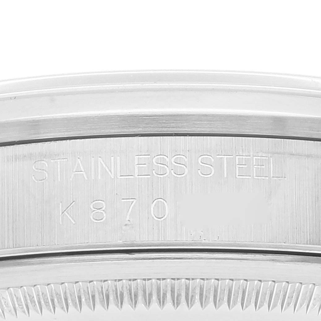 This image shows a close-up of the side of a Rolex Datejust 16200 Men's Stainless Steel White Dial 16200 Men's Stainless Steel White Dial stainless steel watch case, including part of the bezel and engraved text.