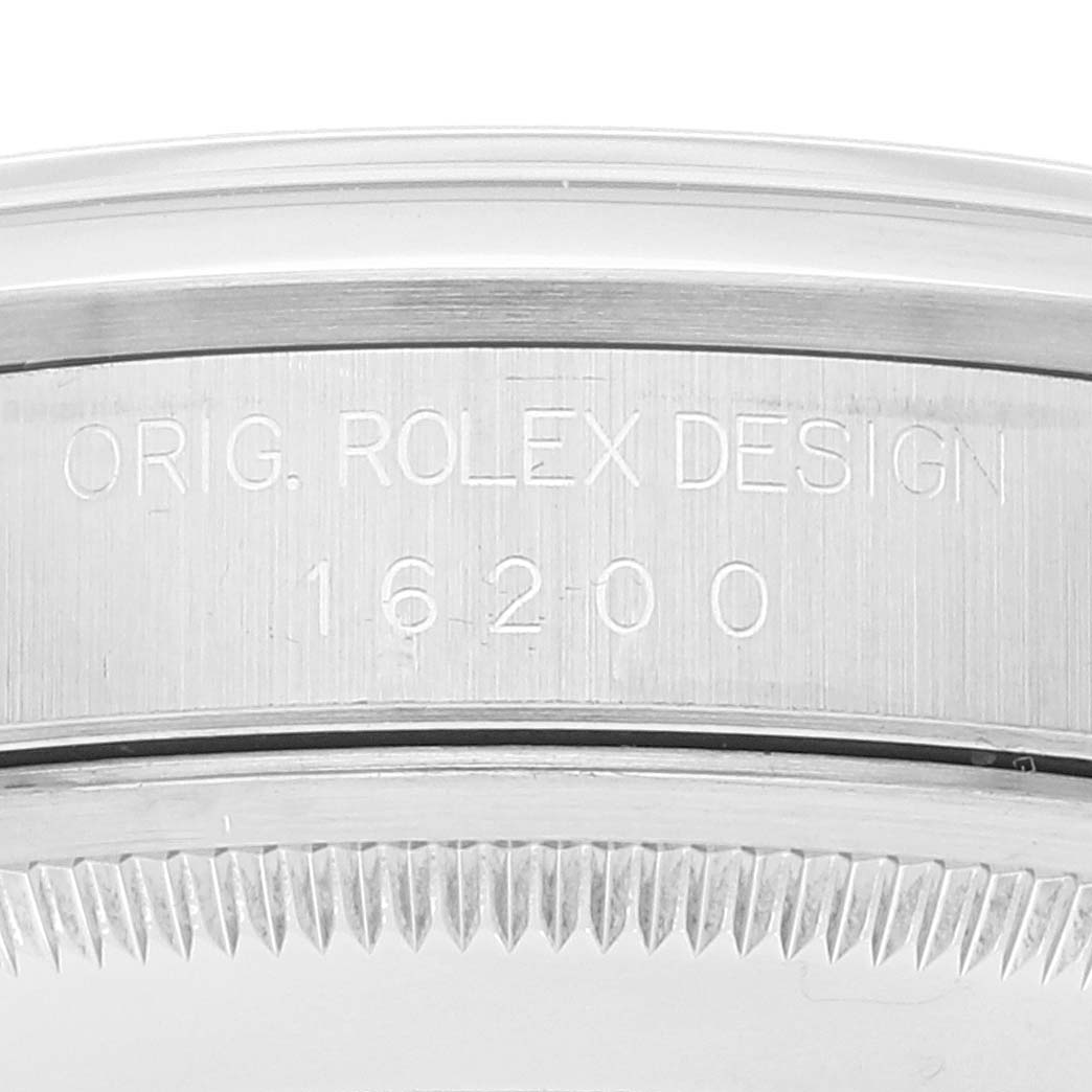 The image shows a close-up view of the case side, focusing on the "Orig. Rolex Design" and model number engraving of a Rolex Datejust 16200 Men's Stainless Steel White Dial 16200 Men's Stainless Steel White Dial.