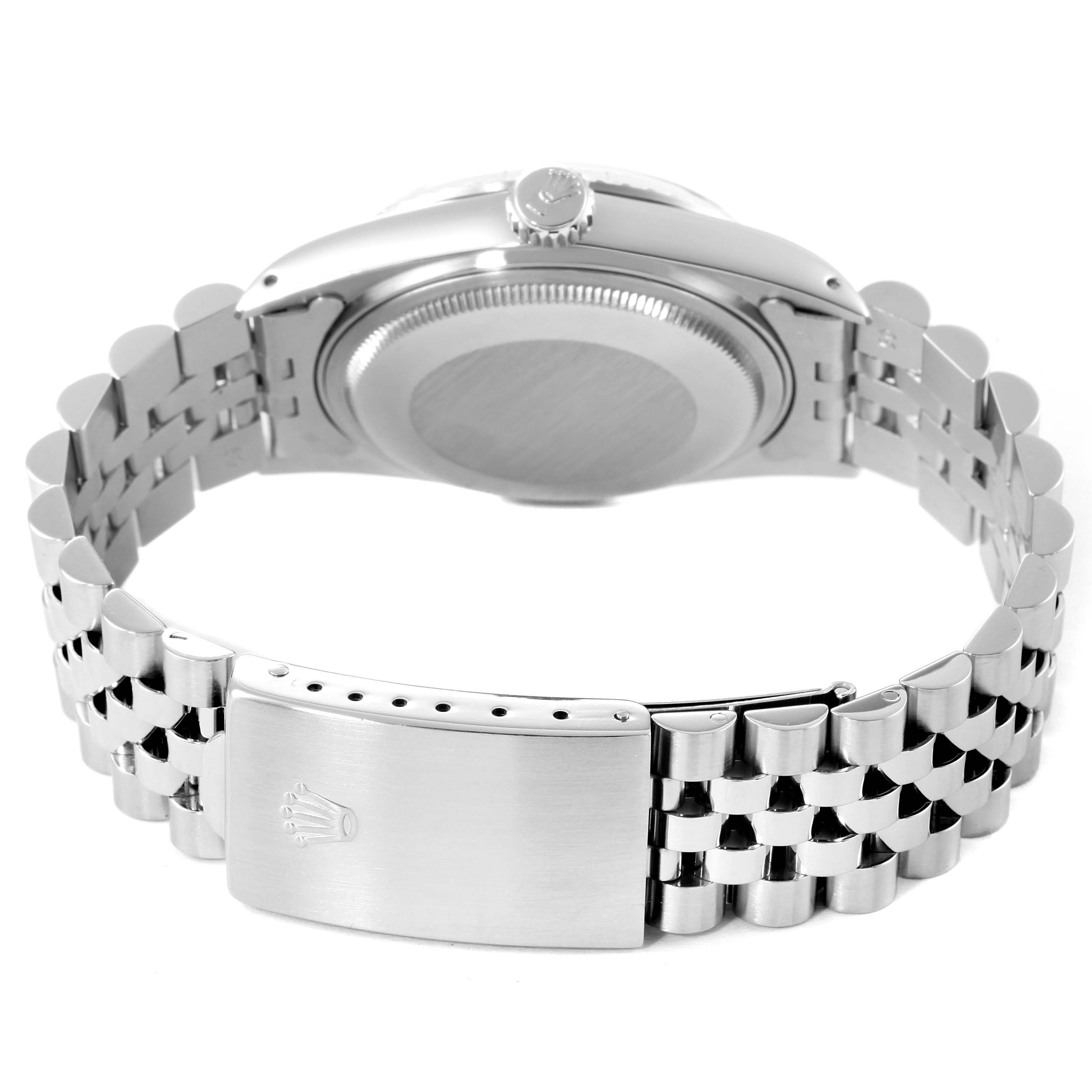 This image shows the back view of a Vintage Collection Rolex watch, focusing on the case back, crown, and metal bracelet with clasp.