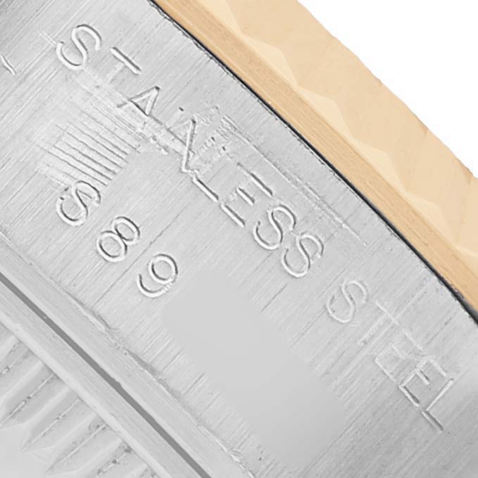 The image shows a close-up of the Rolex Datejust 69173 Women's Steel and Gold (two tone) White Dial watch case back with "Stainless Steel" engraved.
