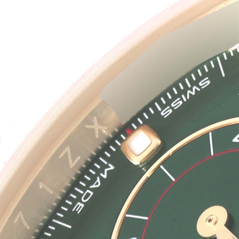 The image shows an up-close view of the dial and part of the bezel of a Rolex Daytona 116508 Men's Yellow Gold Green Dial 116508 Men's Yellow Gold Green Dial watch.