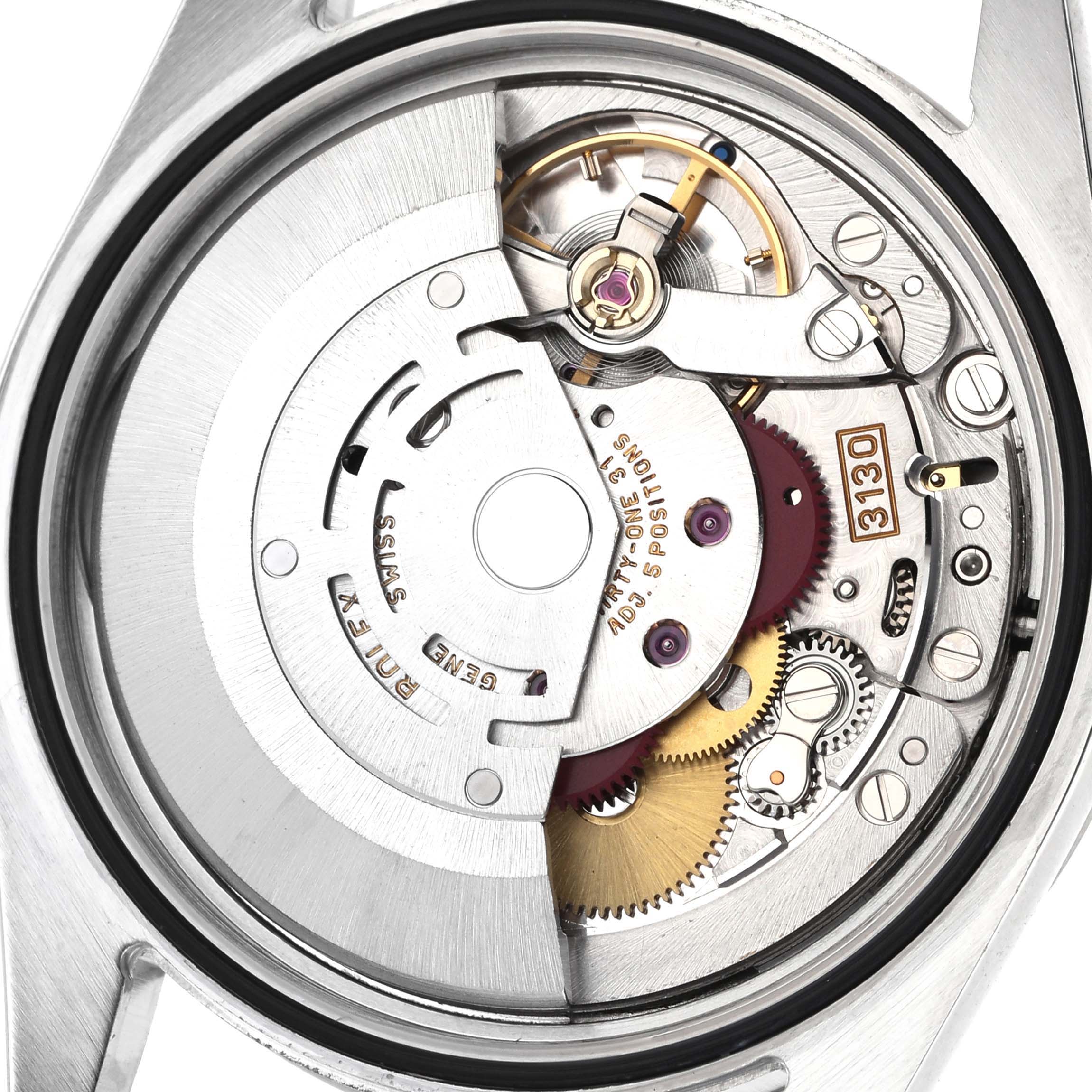 The image shows the movement of the Rolex Explorer 114270 Men's Stainless Steel Black Dial watch from the back, highlighting gears and the rotor.