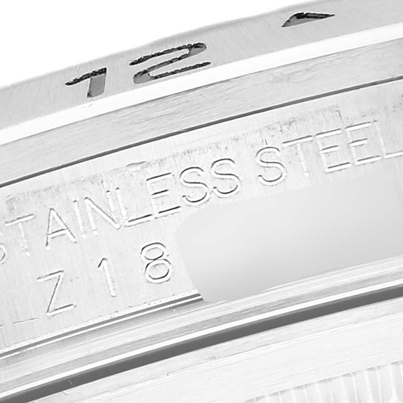 The image shows a close-up of the side engraving and bezel of a Rolex Explorer 16570 Men
s Stainless Steel White Dial 16570 Men
s Stainless Steel White Dial model watch.