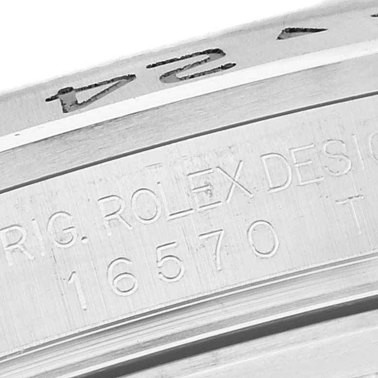 This close-up image shows part of the case back engraving of a Rolex Explorer 16570 Men
s Stainless Steel White Dial 16570 Men
s Stainless Steel White Dial watch, model number 16570.