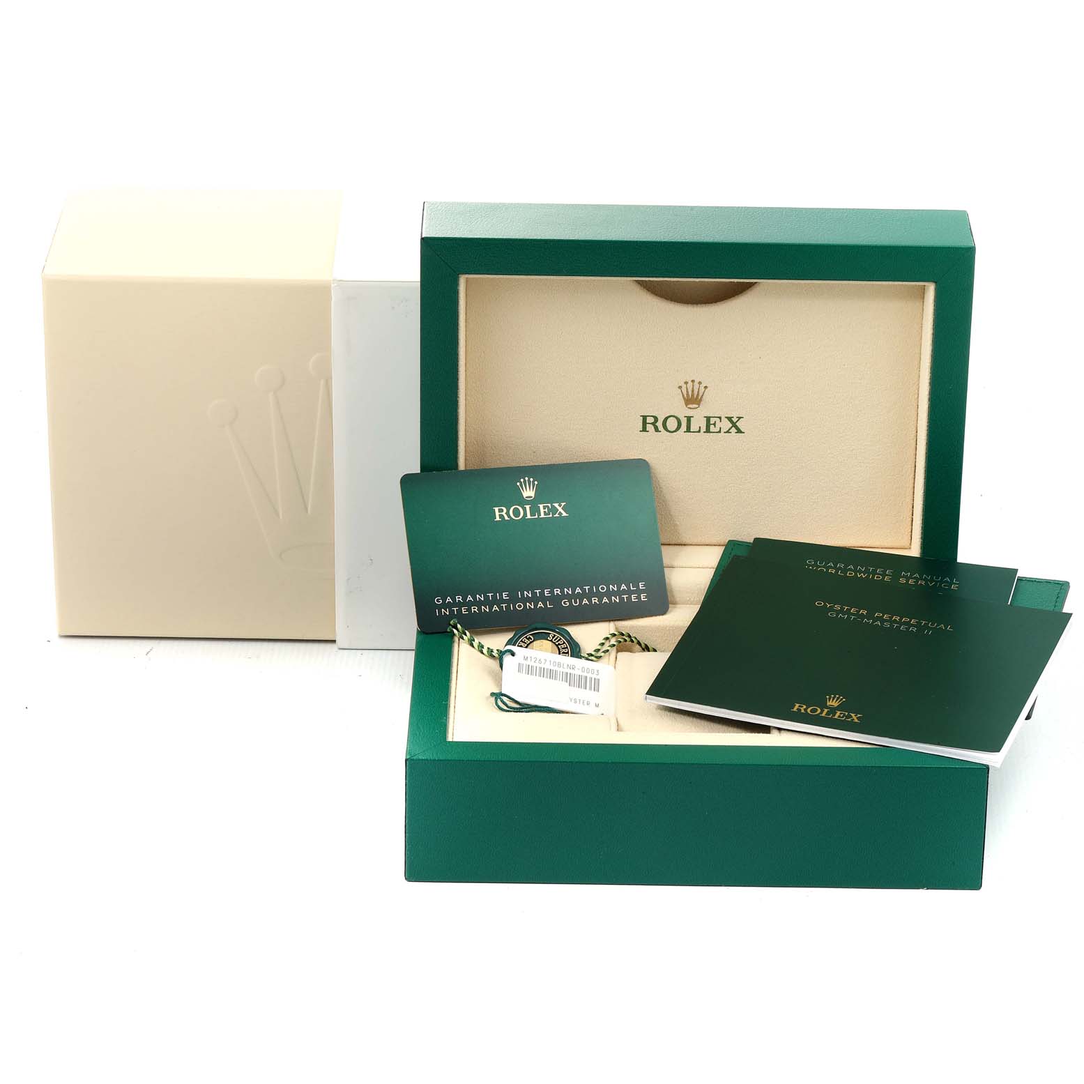 The image shows the packaging and accessories for a Rolex GMT-Master 126710 Men
s Stainless Steel Black Dial 126710 Men
s Stainless Steel Black Dial, including the box, guarantee card, and manuals.