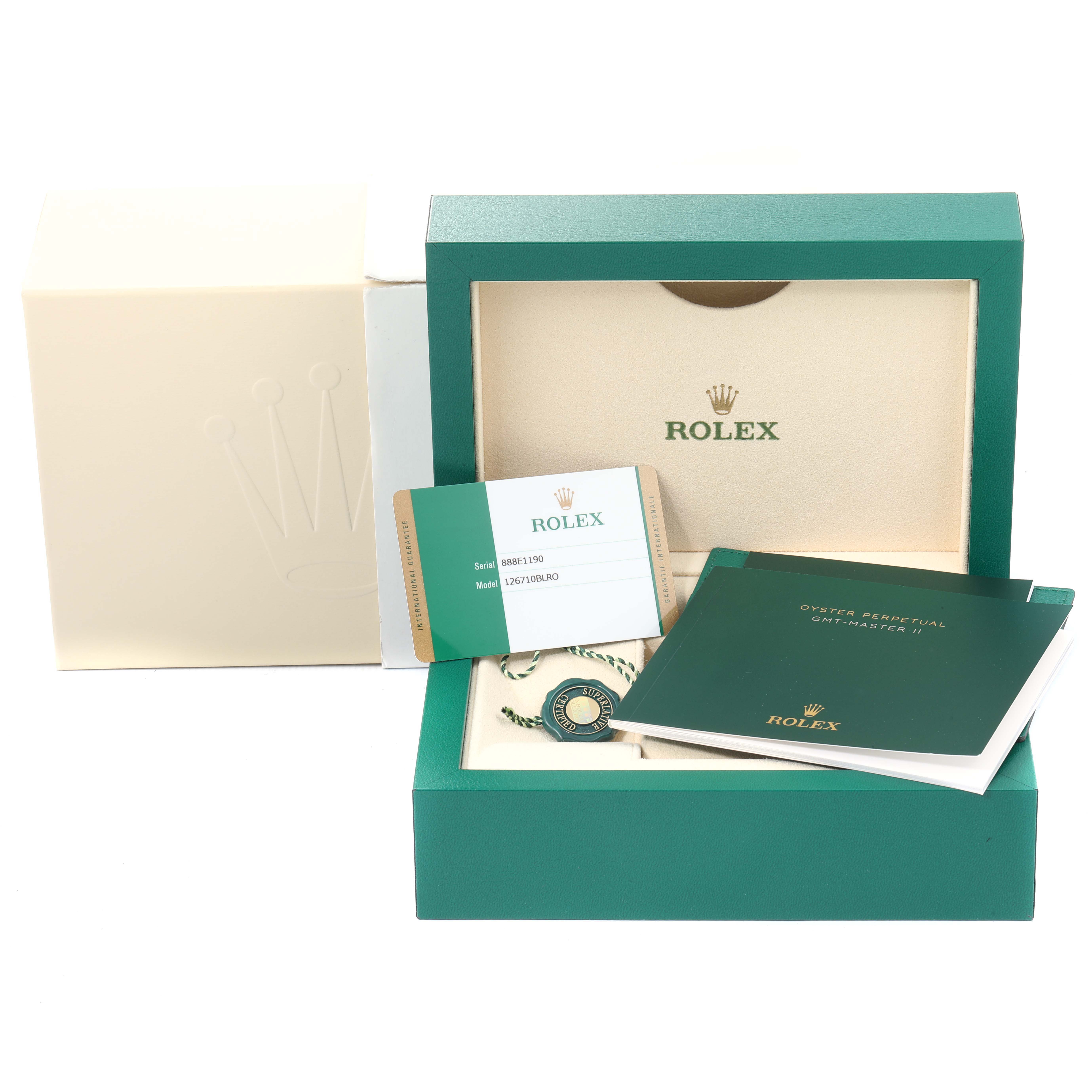 The image shows the packaging and accessories for a Rolex GMT-Master 126710 Men's Stainless Steel Black Dial 126710 Men's Stainless Steel Black Dial watch, including the box, authentication card, and manuals.