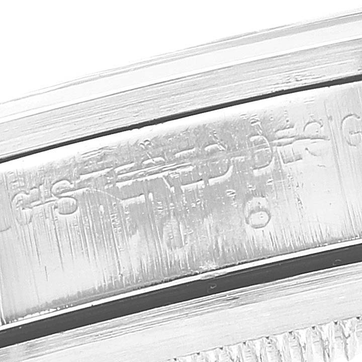 This close-up image shows the engraved text on the inner side of the bezel of a Rolex Vintage Collection 1016 Men
s Stainless Steel Black Dial 1016 Men
s Stainless Steel Black Dial model.