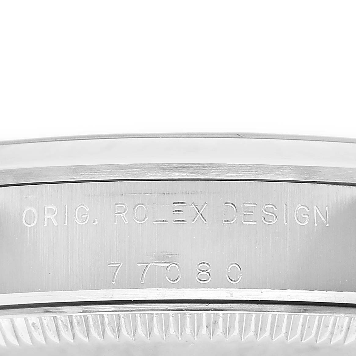 The image shows the side view of a Rolex Oyster Perpetual 77080 Women's Stainless Steel Blue Dial watch case with engraved branding and design number.