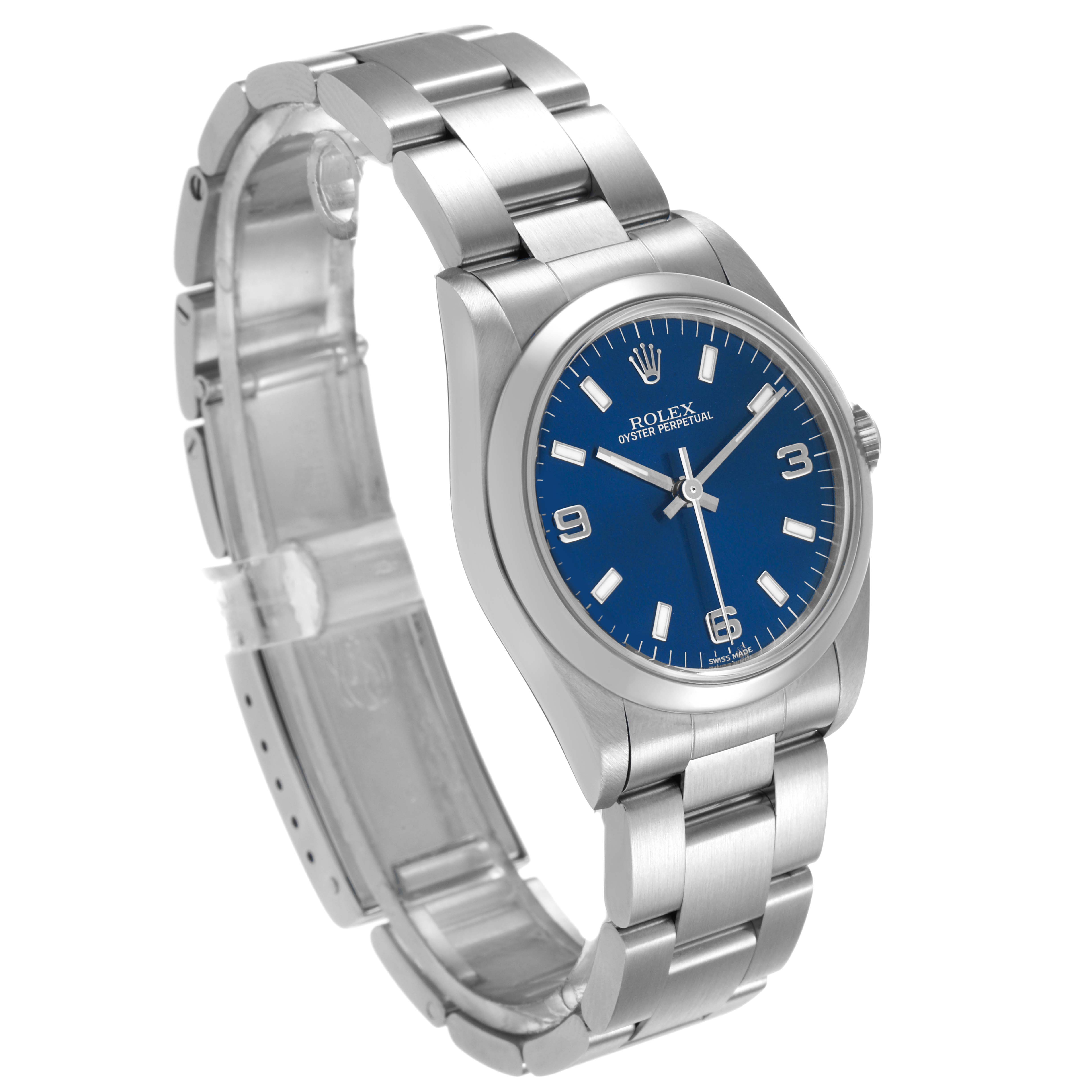 The image shows a Rolex Oyster Perpetual 77080 Women's Stainless Steel Blue Dial watch angled slightly from the left, highlighting its blue dial, bezel, bracelet, and clasp.