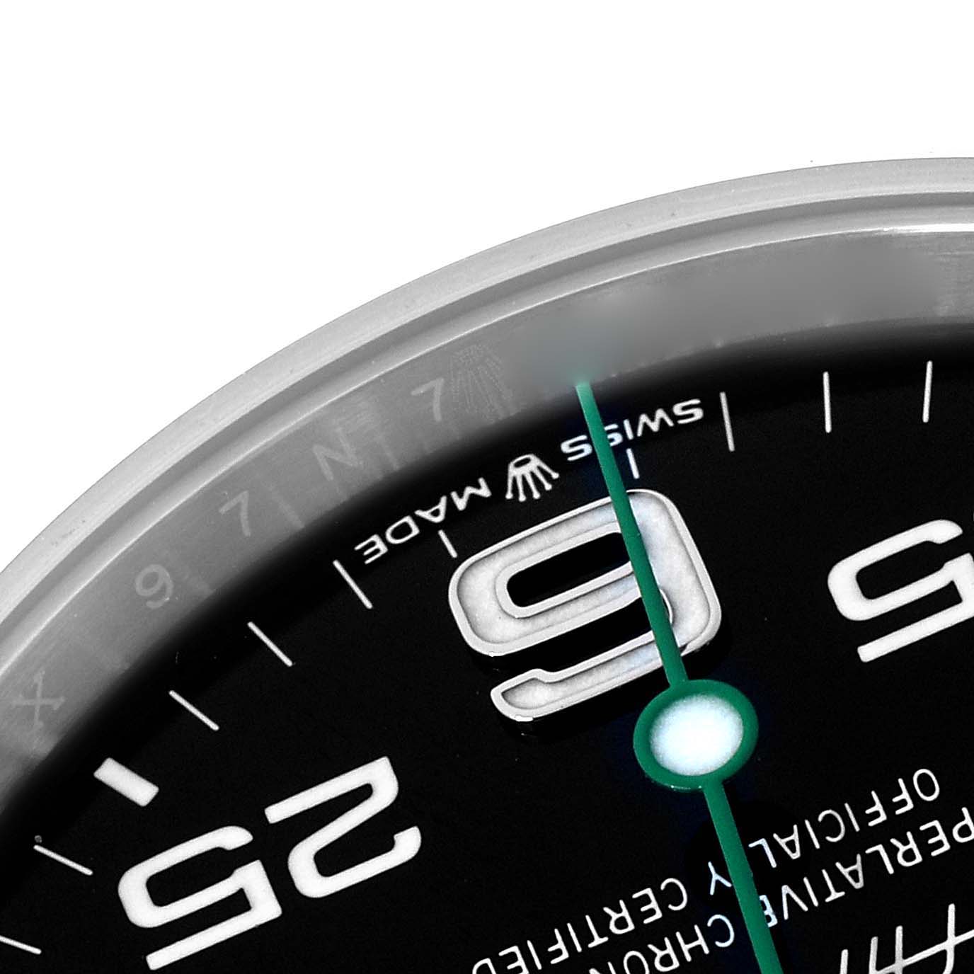 The image shows a close-up of the dial of a Rolex Air-King 126900 Men's Stainless Steel Black Dial, highlighting the 9 o'clock marker and minute markings.