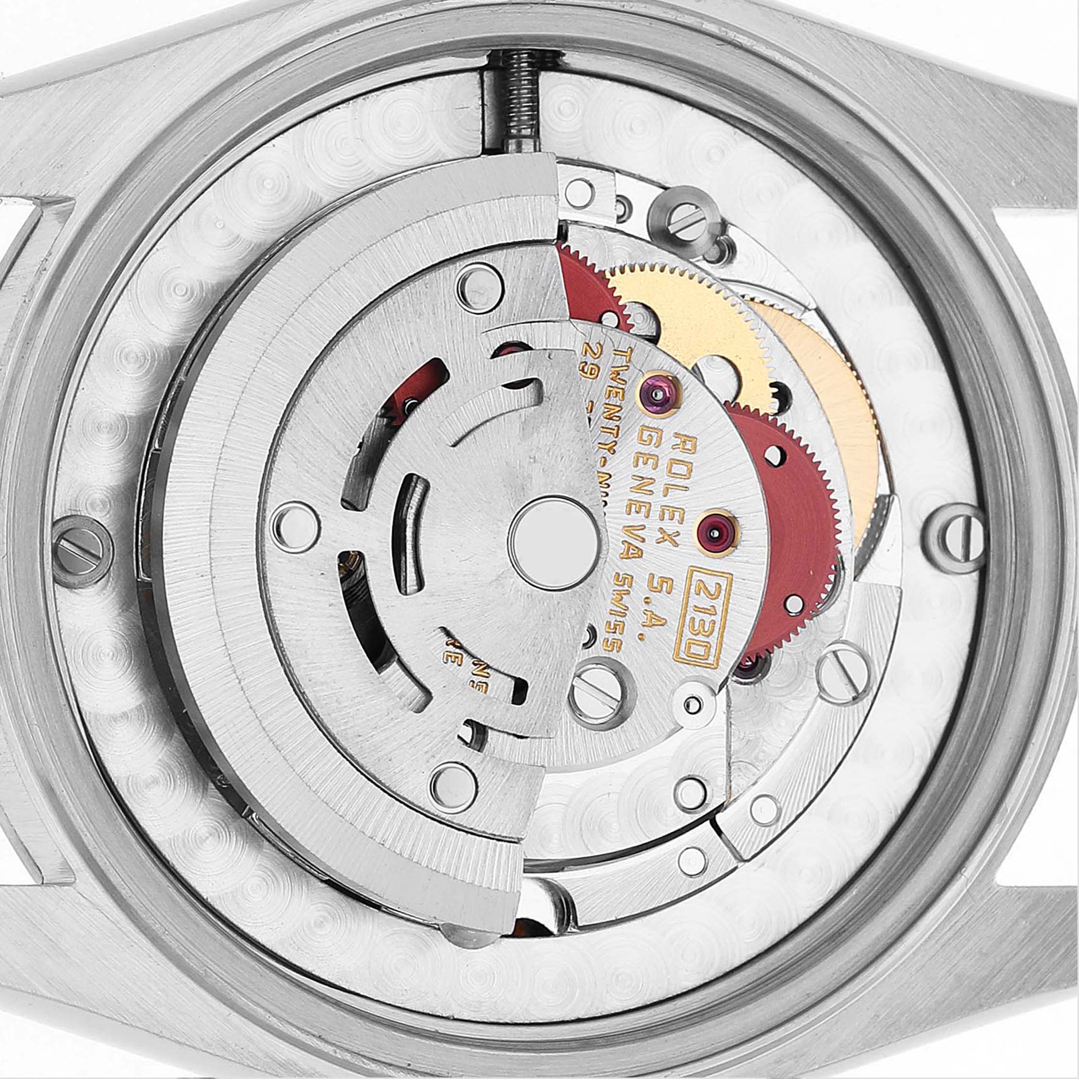 The image shows the inner mechanism of a Rolex Oyster Perpetual 67480 Women's Stainless Steel Pink Dial watch from a top-down angle.