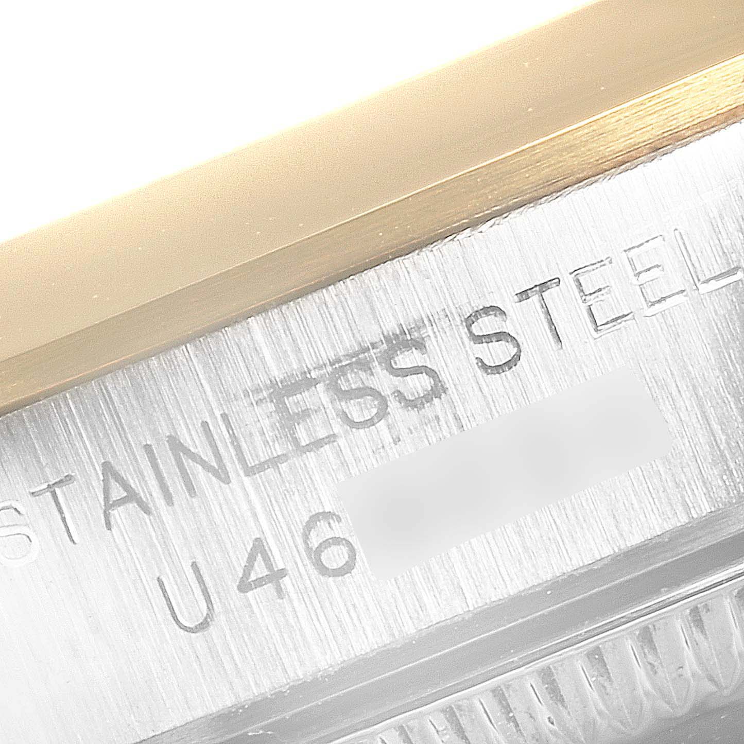 This close-up image shows the side engraving on a stainless steel Rolex Oyster Perpetual 67183 Women's Steel and Gold (two tone) Grey Dial 67183 Women's Steel and Gold (two tone) Grey Dial watch.