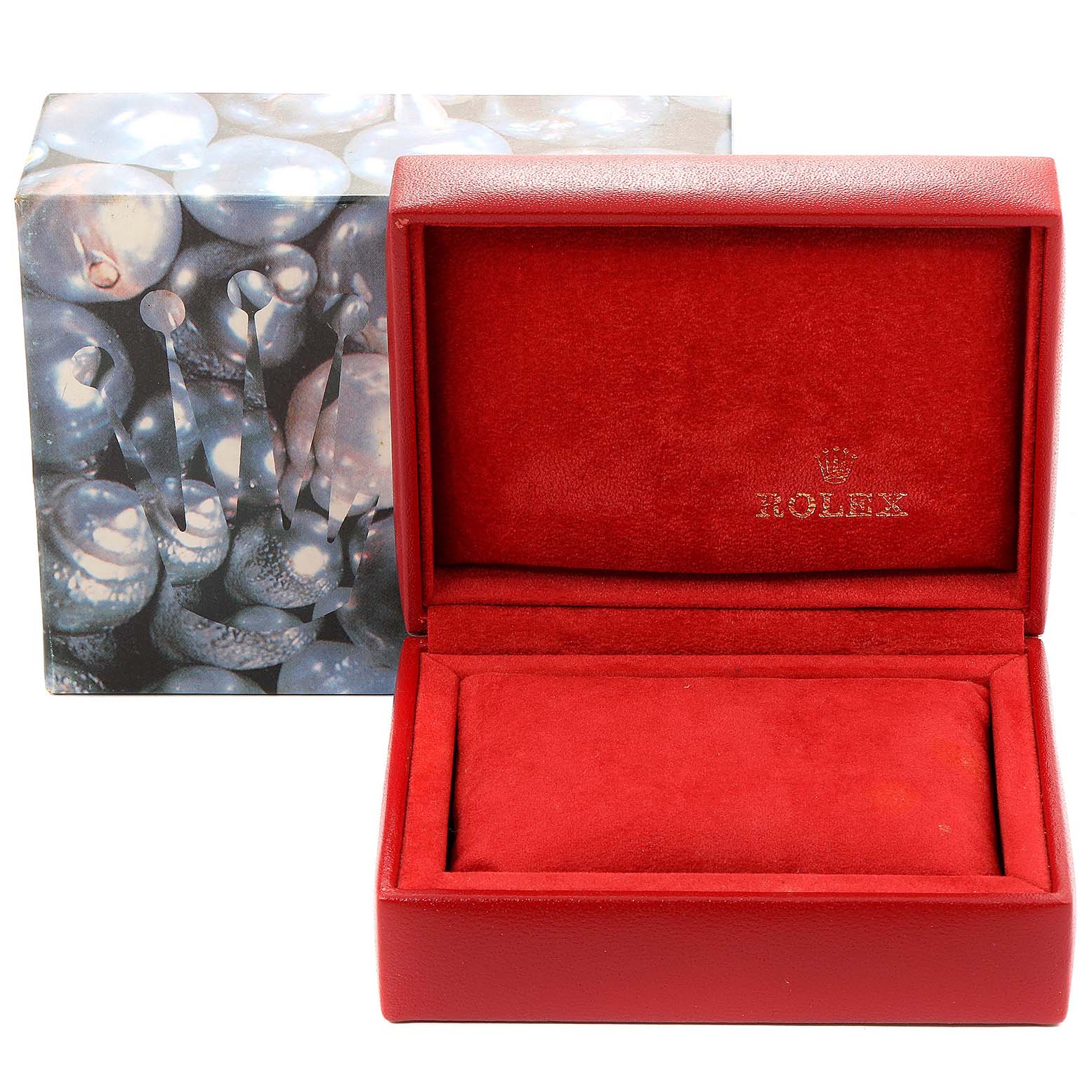 This image shows a red Rolex watch box with the Oyster Perpetual model branding, placed in front of a decorative outer box.