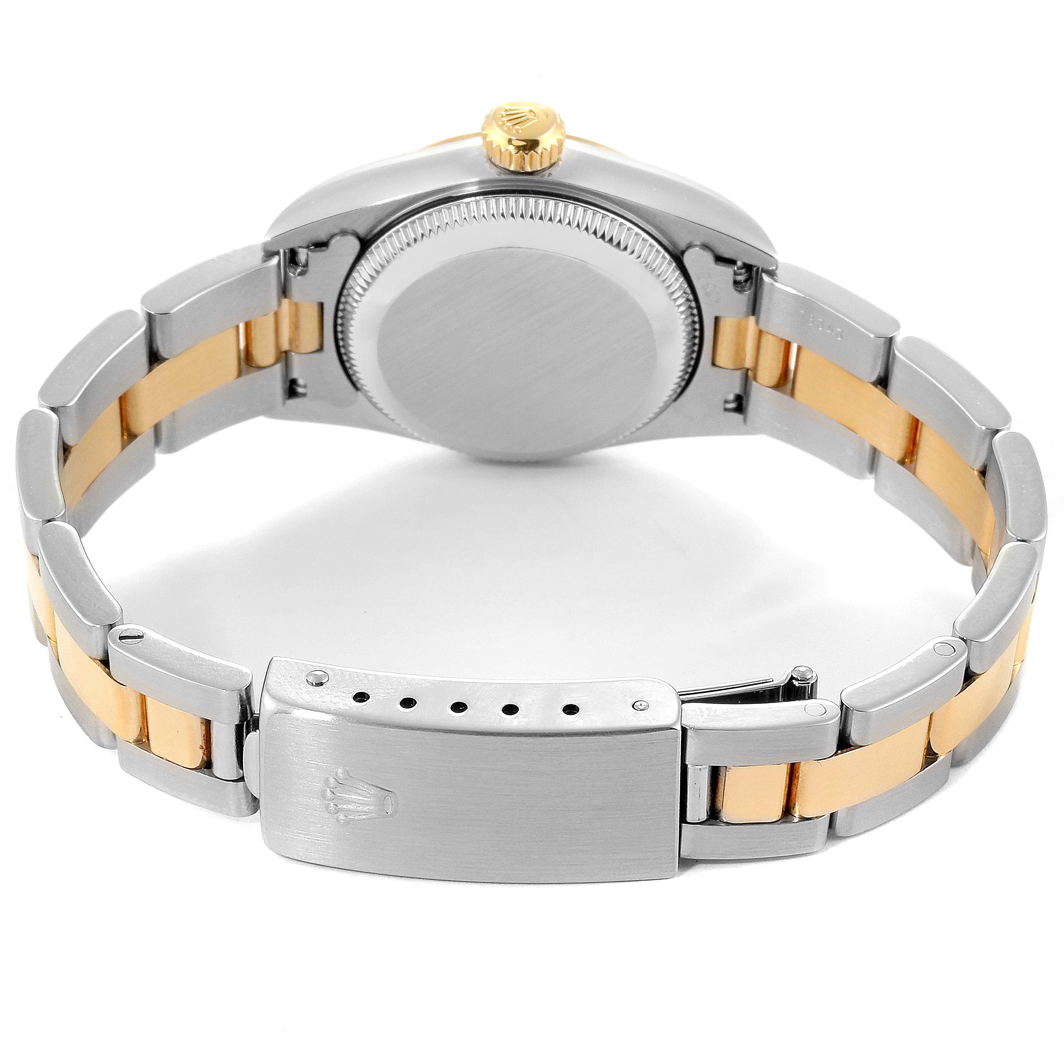 The image shows the back view of a Rolex Oyster Perpetual 67183 Women's Steel and Gold (two tone) Grey Dial 67183 Women's Steel and Gold (two tone) Grey Dial watch, highlighting its case back and bracelet clasp.
