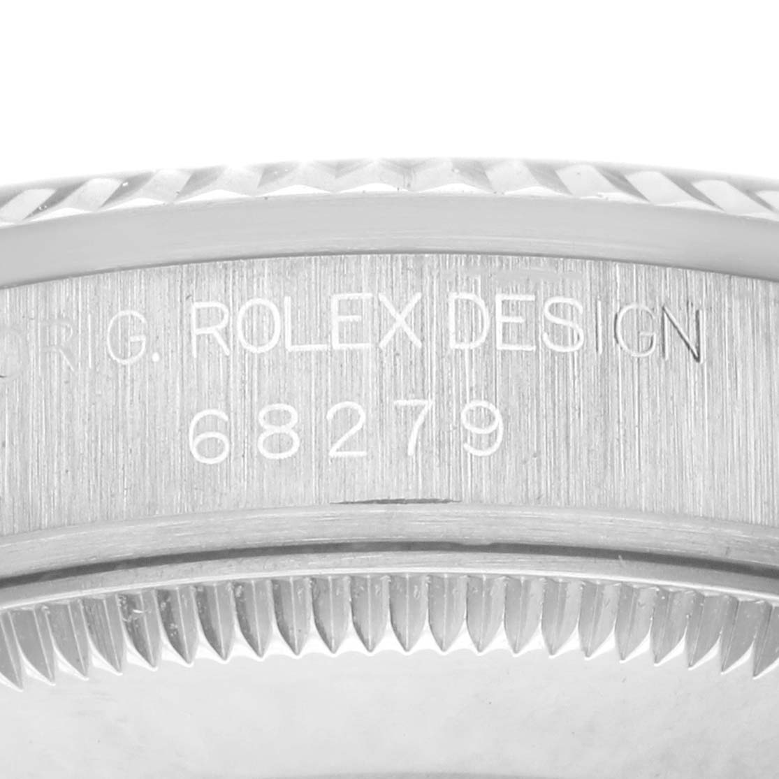This image shows a close-up of the case side of a Rolex Datejust 68279 Women's White Gold Silver Dial, focusing on the engraved model number and bezel edge.
