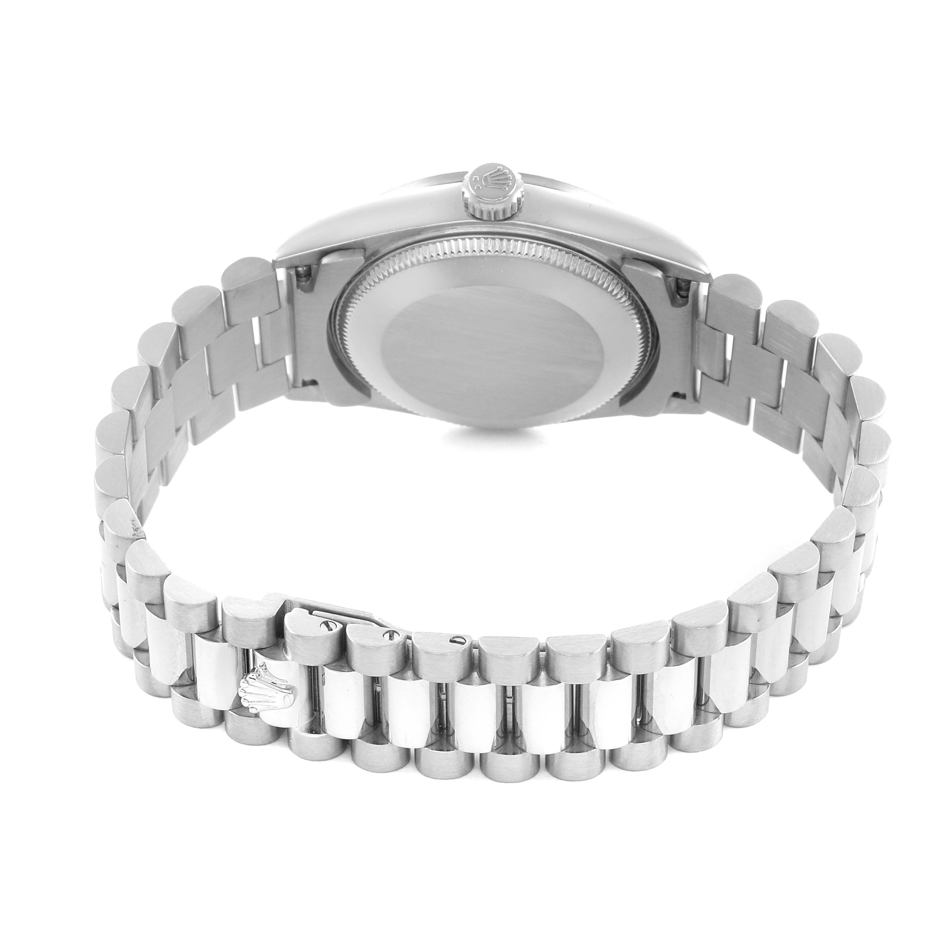 The Rolex Datejust 68279 Women's White Gold Silver Dial watch is shown from the back, highlighting the case back and the Jubilee bracelet with its clasp.