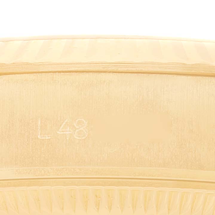 This is a close-up image showing the side of the Rolex President 69178 Women
s Yellow Gold Champagne Dial 69178 Women
s Yellow Gold Champagne Dial model, highlighting its engraved serial number.