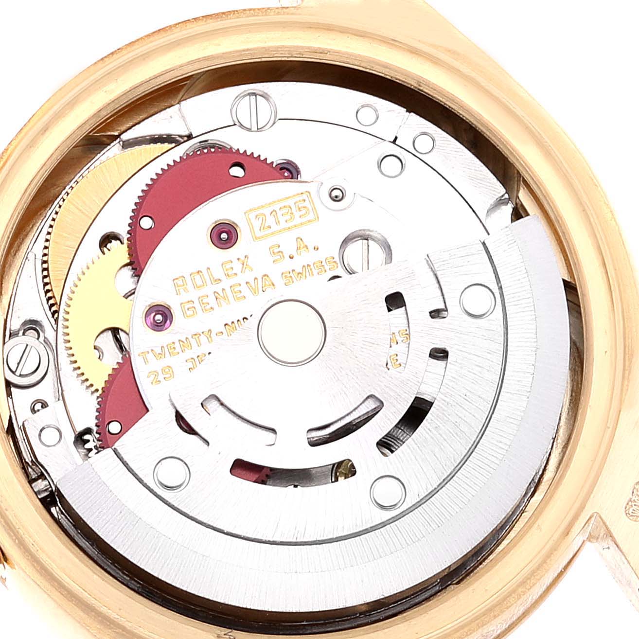 The image shows the internal mechanism of a Rolex President 69178 Women
s Yellow Gold Champagne Dial 69178 Women
s Yellow Gold Champagne Dial model watch, highlighting the movement and gears.