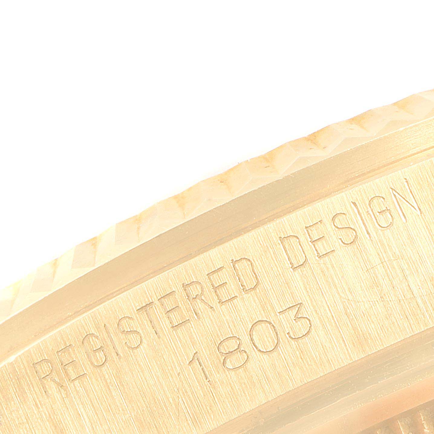 The image shows a close-up view of the engraved bezel and side of the Rolex Vintage Collection 1803 Men's Yellow Gold Champagne Dial 1803 Men's Yellow Gold Champagne Dial model watch, with the design number "1803".