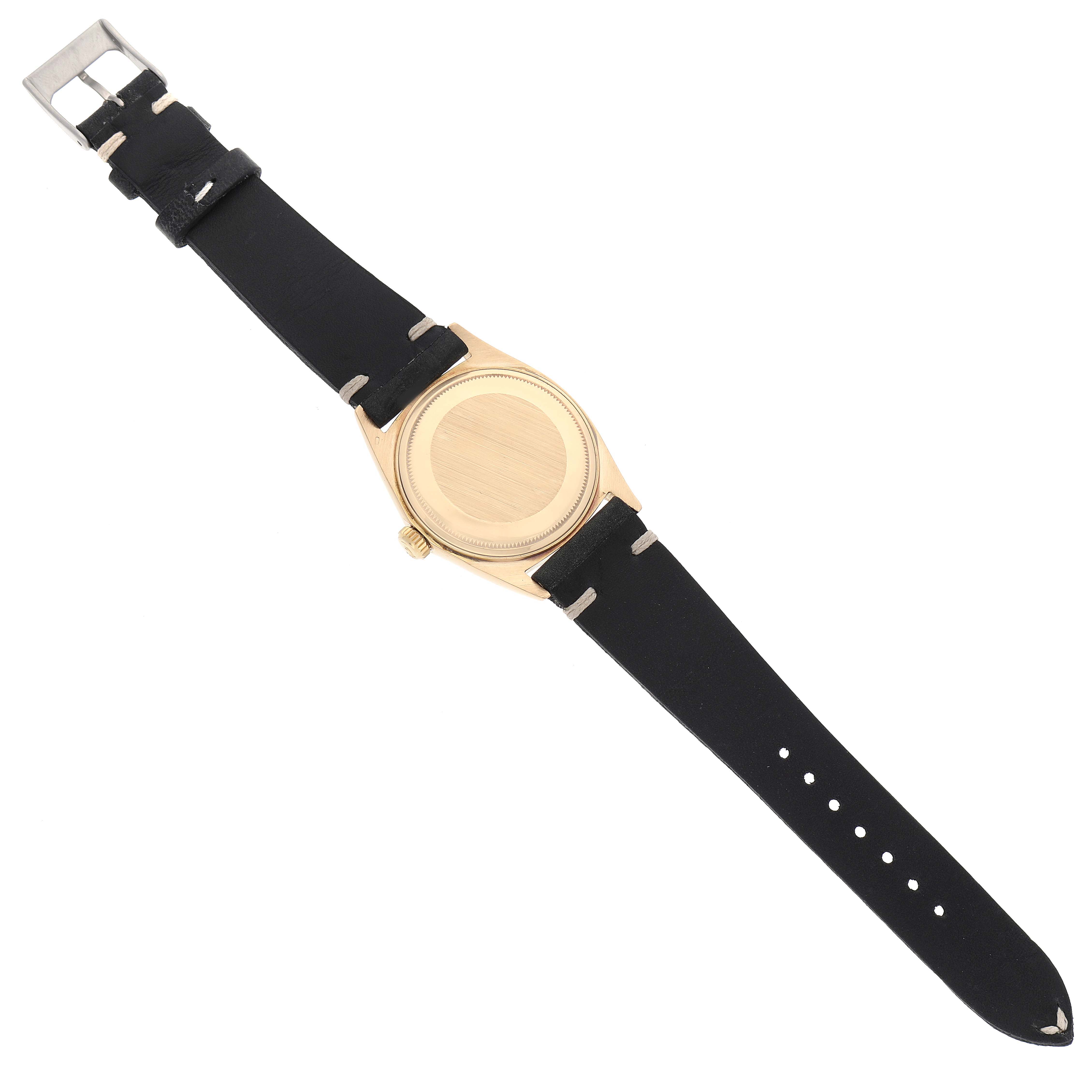 The image shows the back view of a Vintage Collection Rolex watch with a black leather strap and gold case.