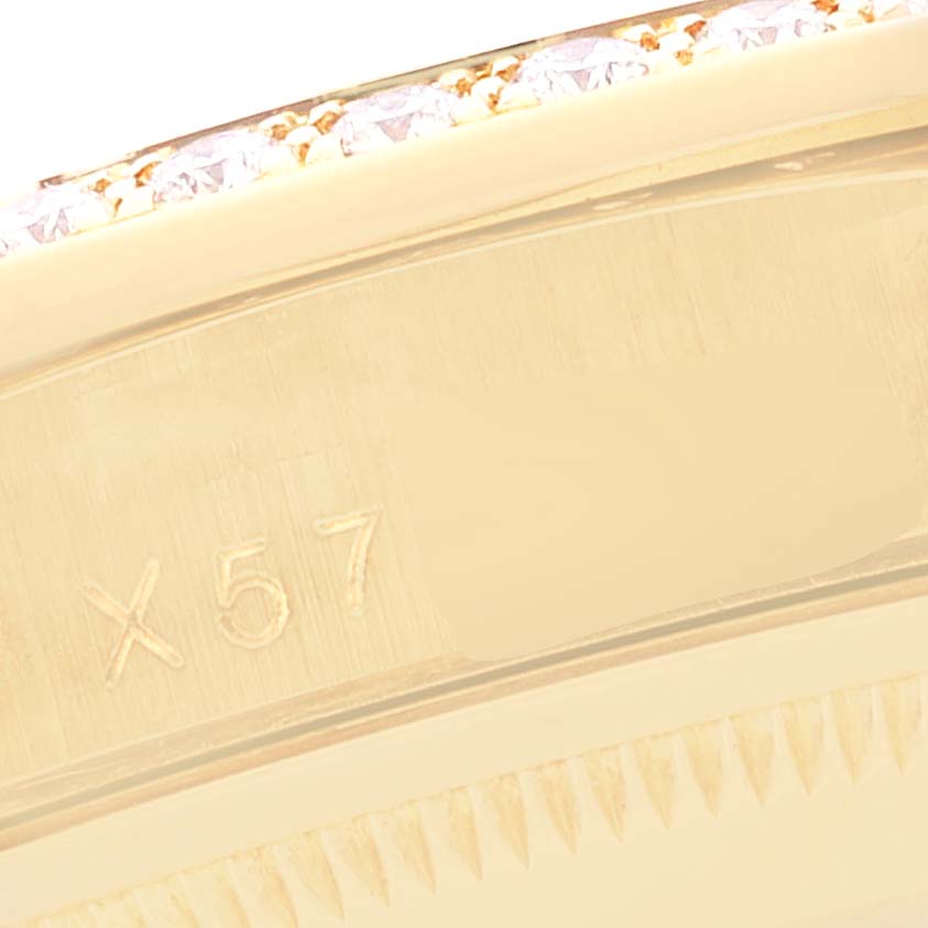 The image shows a close-up of part of the case or bezel of a Rolex President 18388 Men
s Yellow Gold Champagne Dial 18388 Men
s Yellow Gold Champagne Dial model watch, with engraving visible.