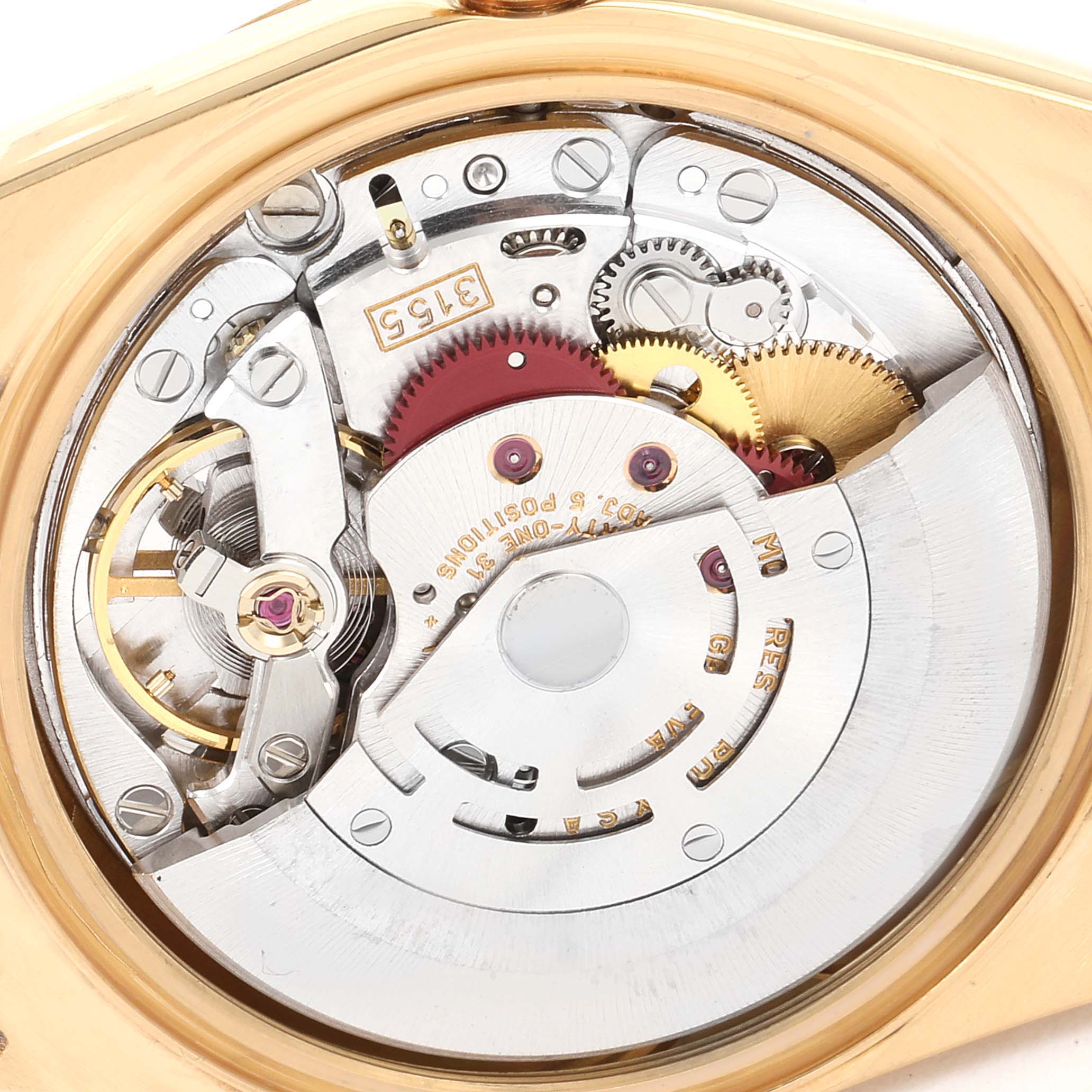 The image shows the inner mechanism of the Rolex President 18238 Men's Yellow Gold Champagne Dial 18238 Men's Yellow Gold Champagne Dial model watch, highlighting the intricate gears and movement components.