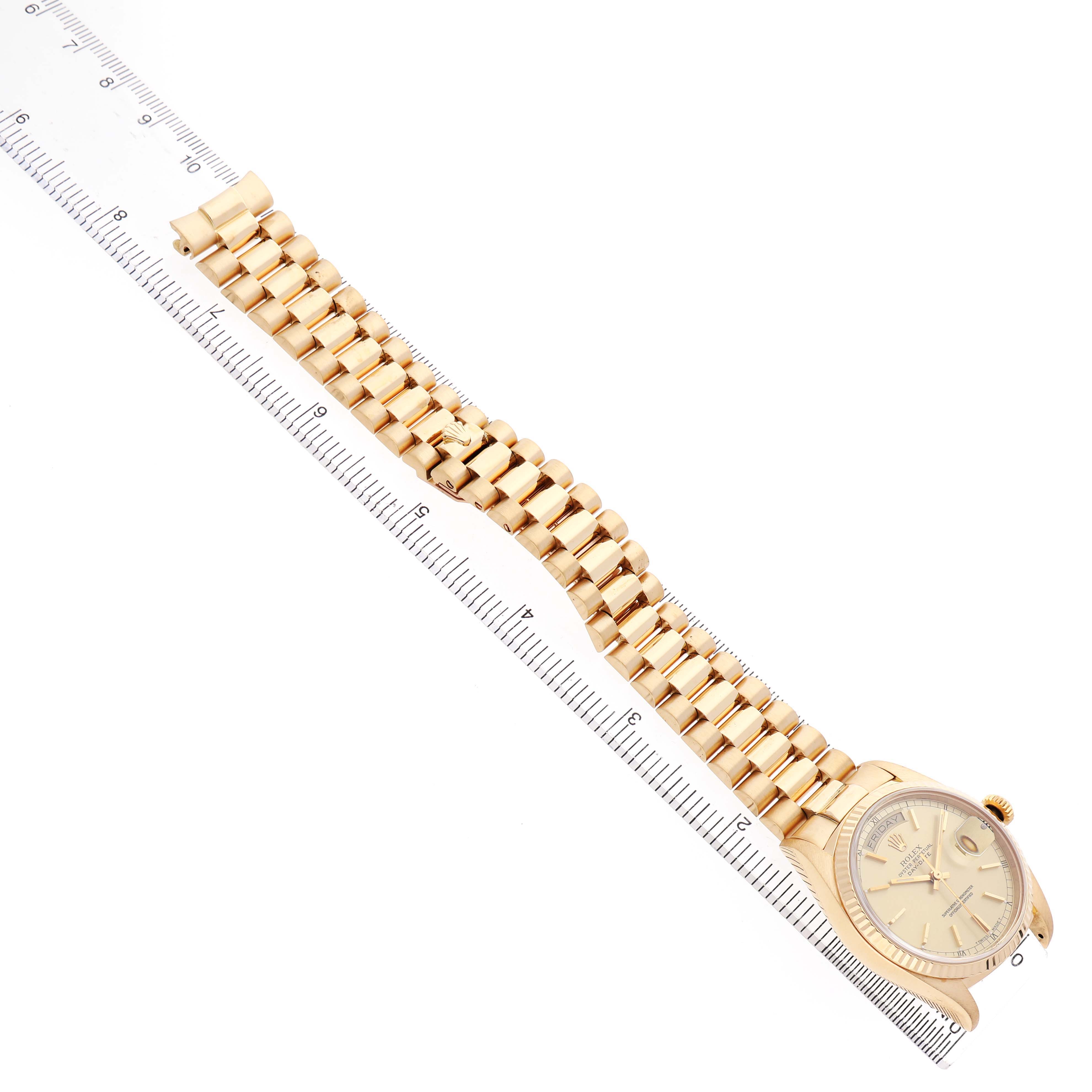 The Rolex President 18038 Men's Yellow Gold Champagne Dial watch is shown diagonally from above, featuring the bracelet, face, and part of the bezel.