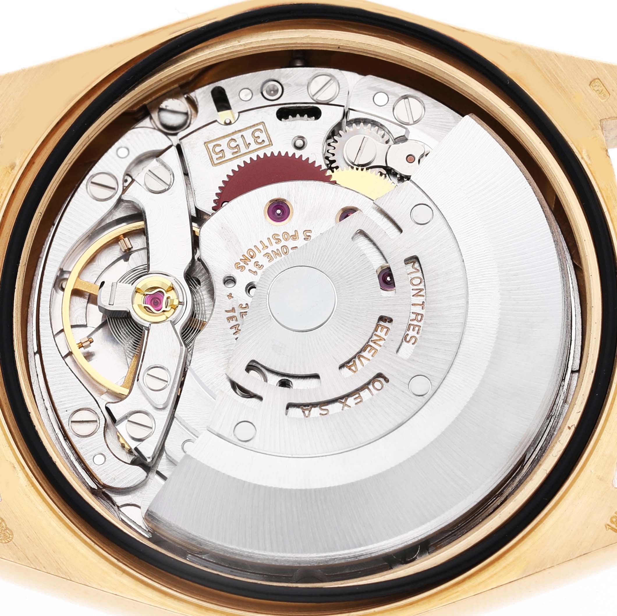 The image shows a close-up bottom view of the movement inside the Rolex President 18238 Men's Yellow Gold Champagne Dial watch, highlighting the rotor and mechanical components.