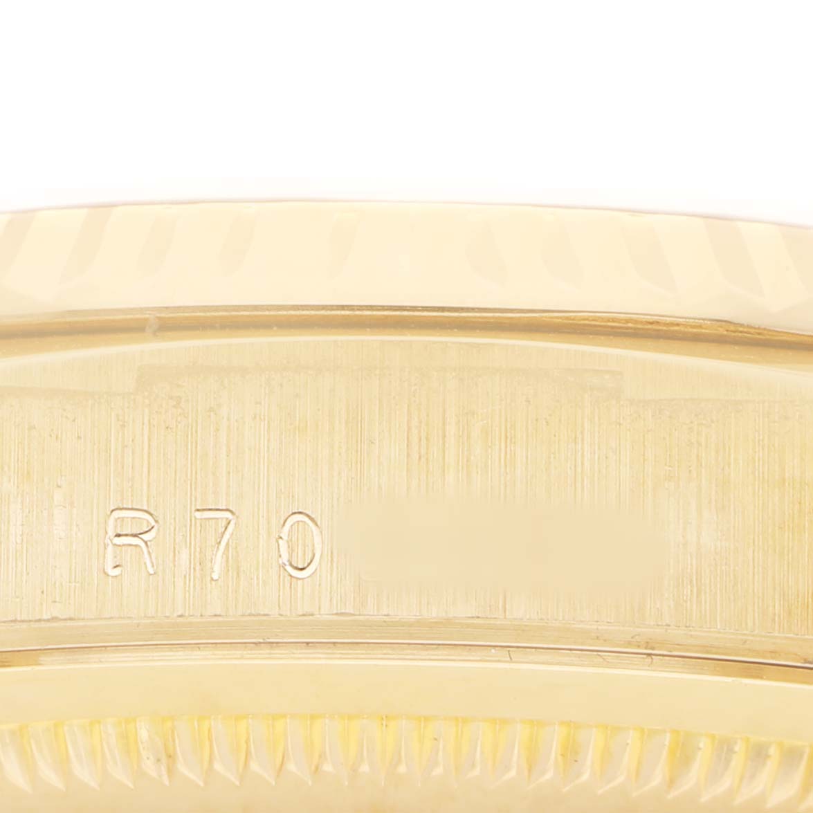 The image shows the side view of a Rolex President 18238 Men's Yellow Gold Champagne Dial model, focusing on the engraved watch case.