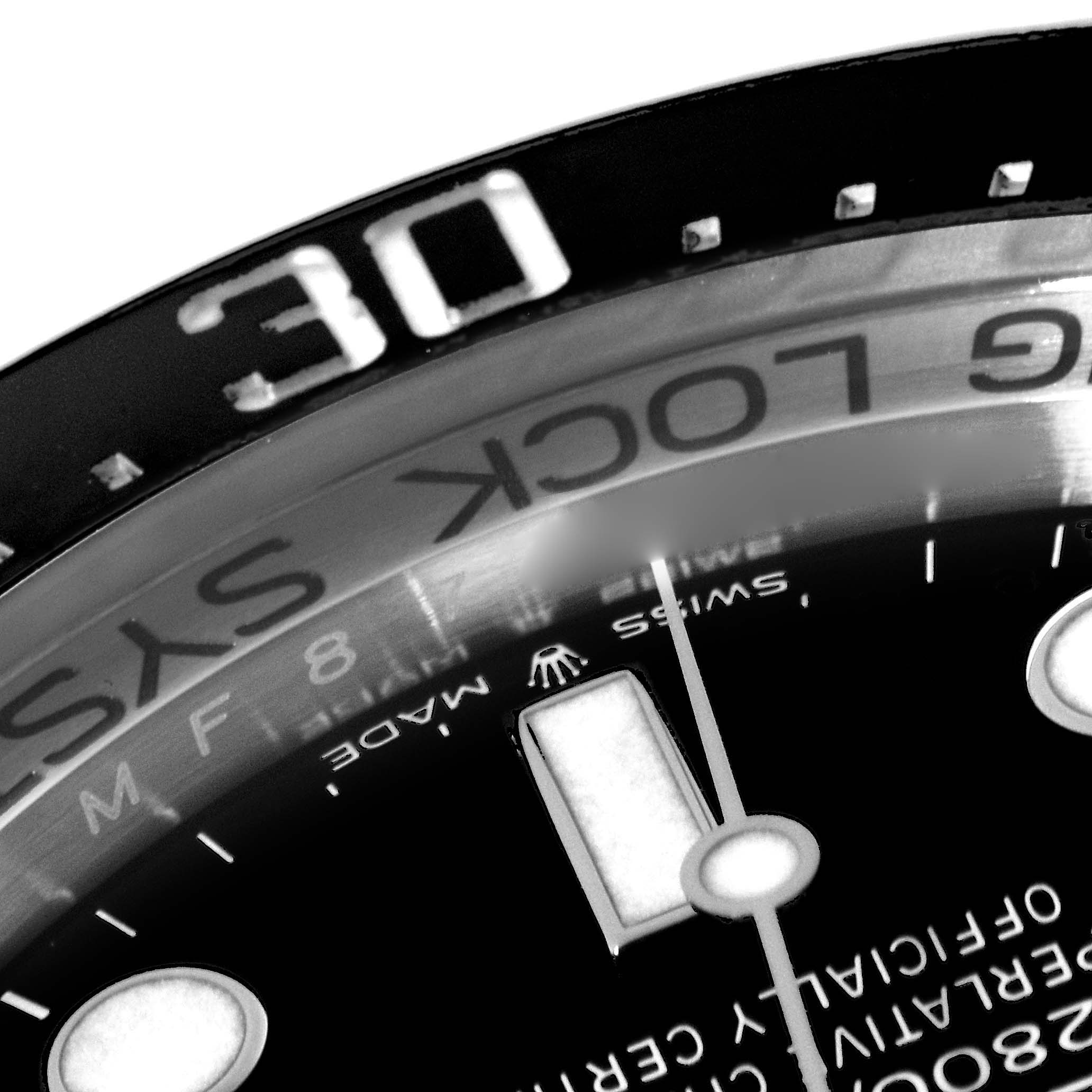 The image shows a close-up of the bezel and part of the dial of a Rolex Sea-Dweller 136660 Men
s Stainless Steel Black Dial 136660 Men
s Stainless Steel Black Dial watch.