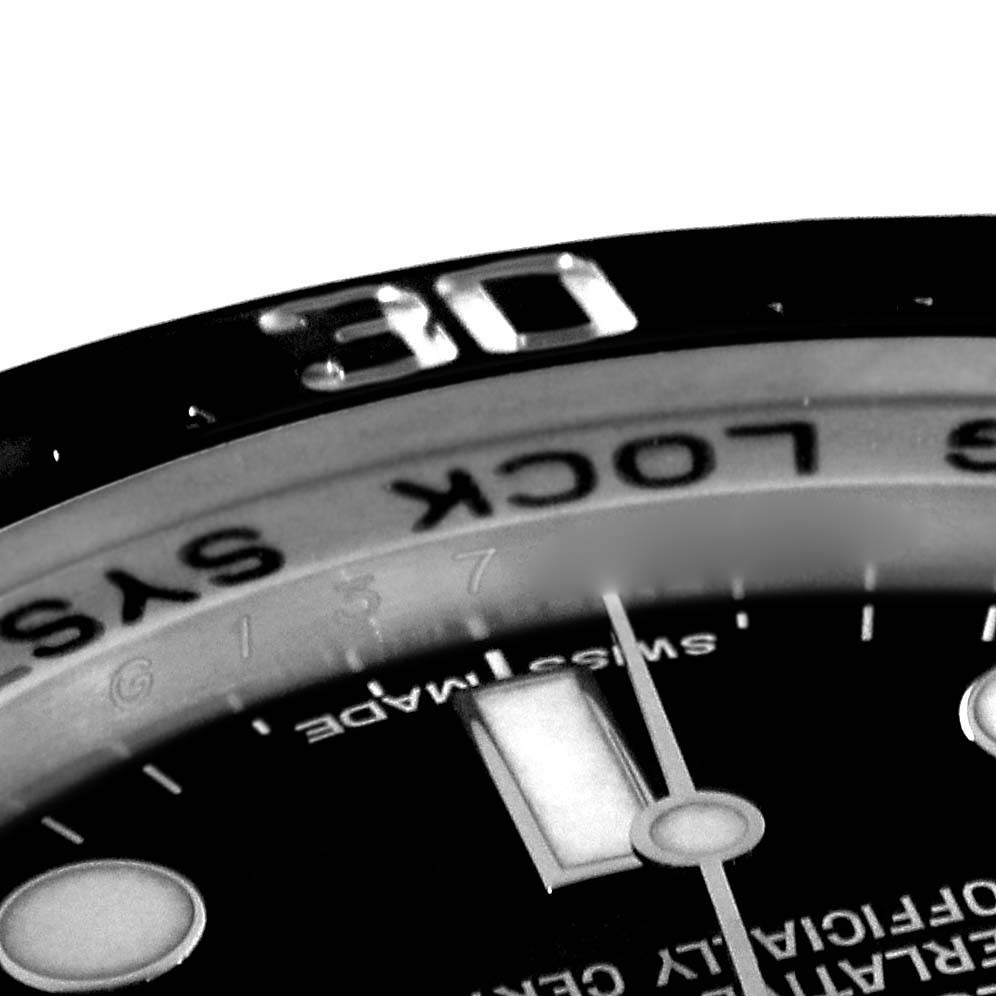 This image shows a close-up view of the bezel and dial of a Rolex Sea-Dweller 116660 Men
s Stainless Steel Black Dial 116660 Men
s Stainless Steel Black Dial watch.