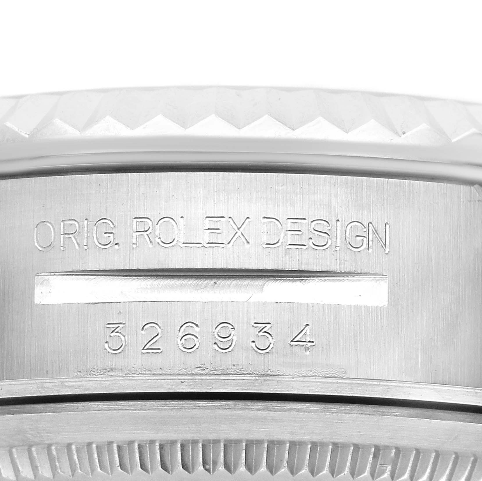 The image shows a close-up of the side of a Rolex Sky-Dweller 326934 Men's Stainless Steel Black Dial, highlighting the engraved design and model number "326934."