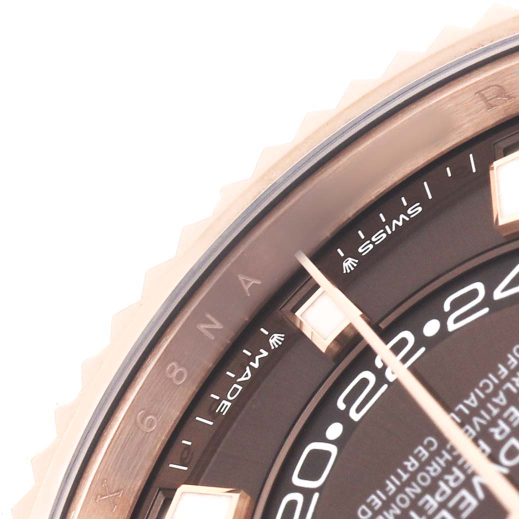 The image shows a close-up of the bezel and part of the dial of a Rolex Daytona 336235 Men's Rose Gold Brown Dial watch, highlighting the hour markers and text.