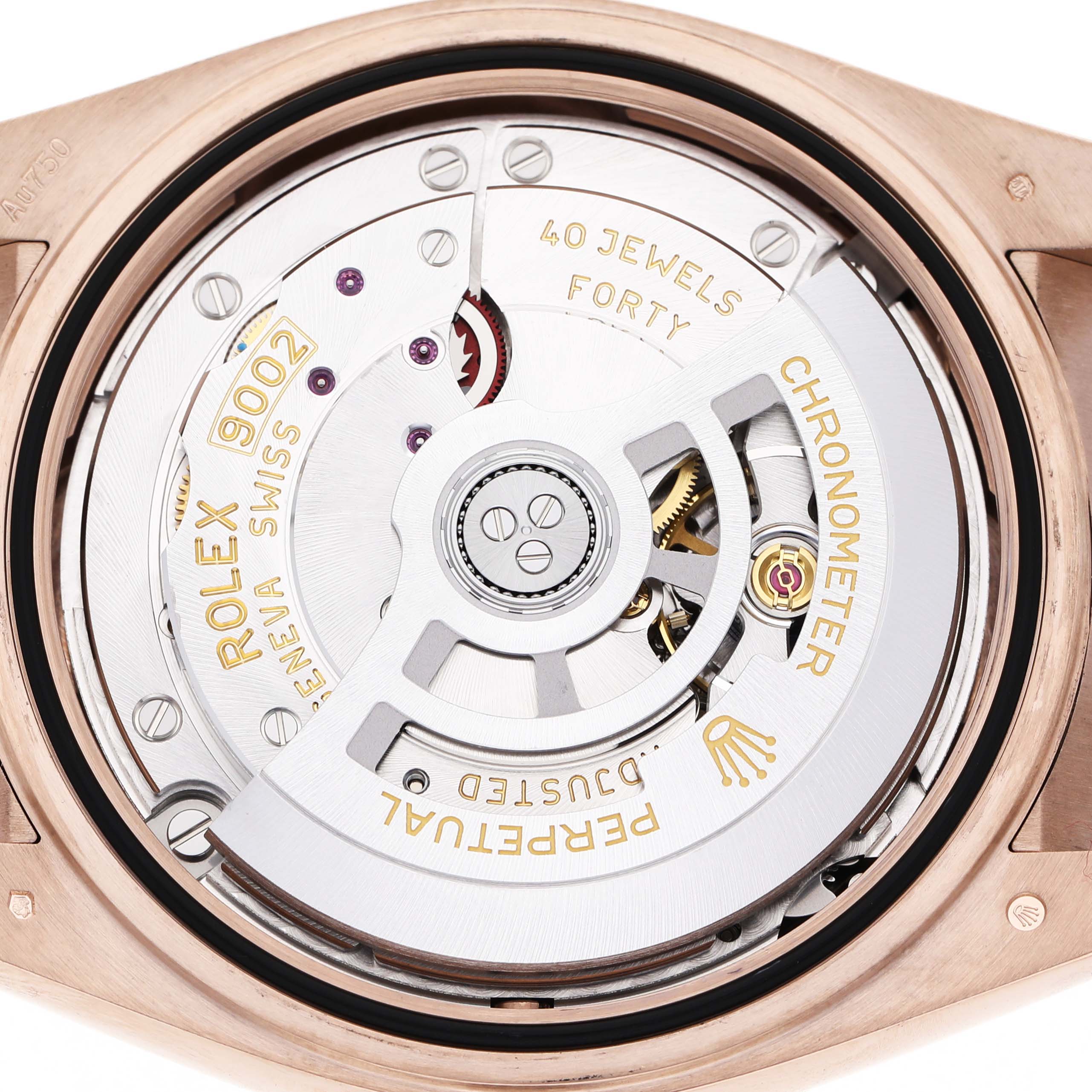 The image shows the movement of a Rolex Daytona 336235 Men's Rose Gold Brown Dial watch, viewed from the back, highlighting the rotor and engravings.