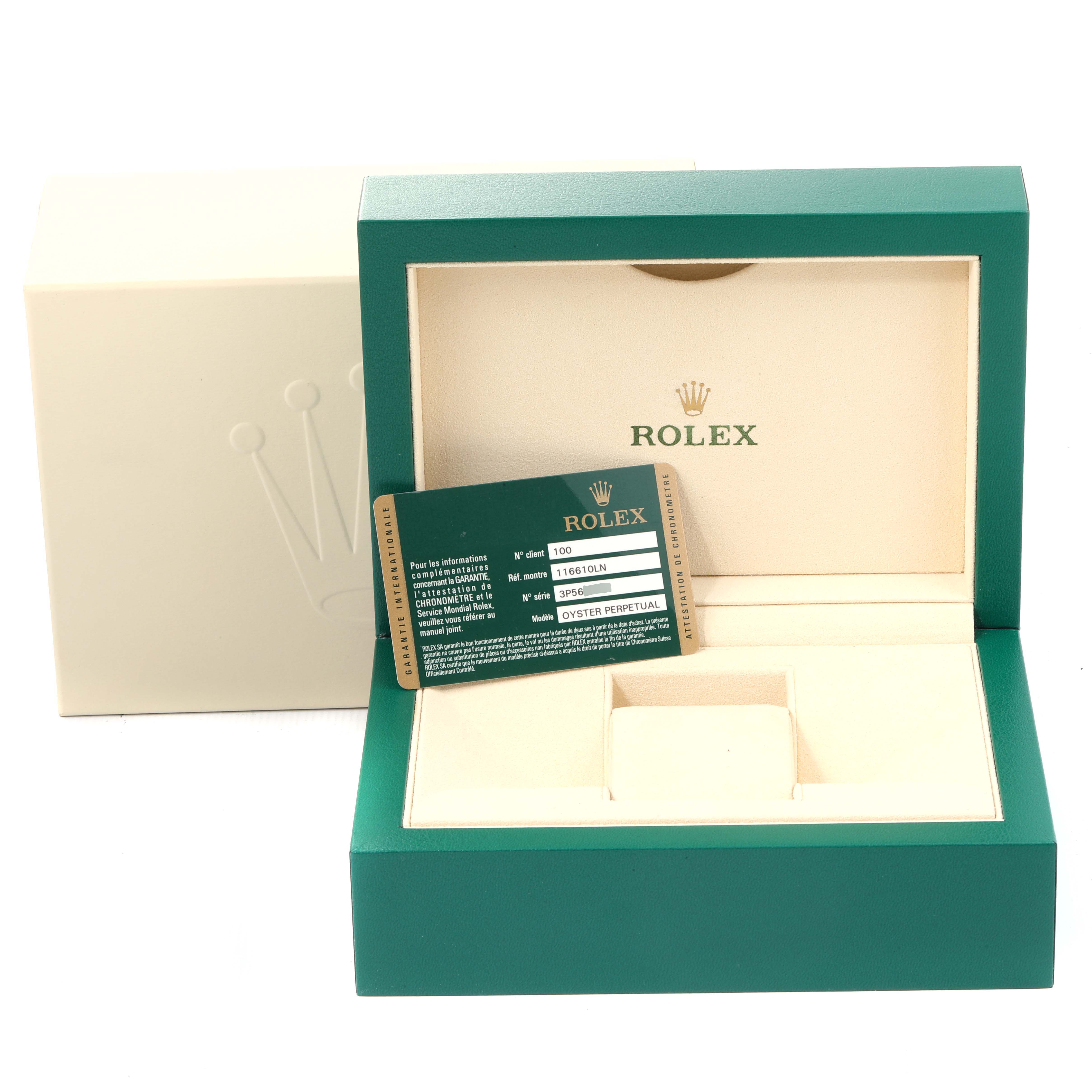This image shows an open Rolex box for a Submariner model, along with a certification card.