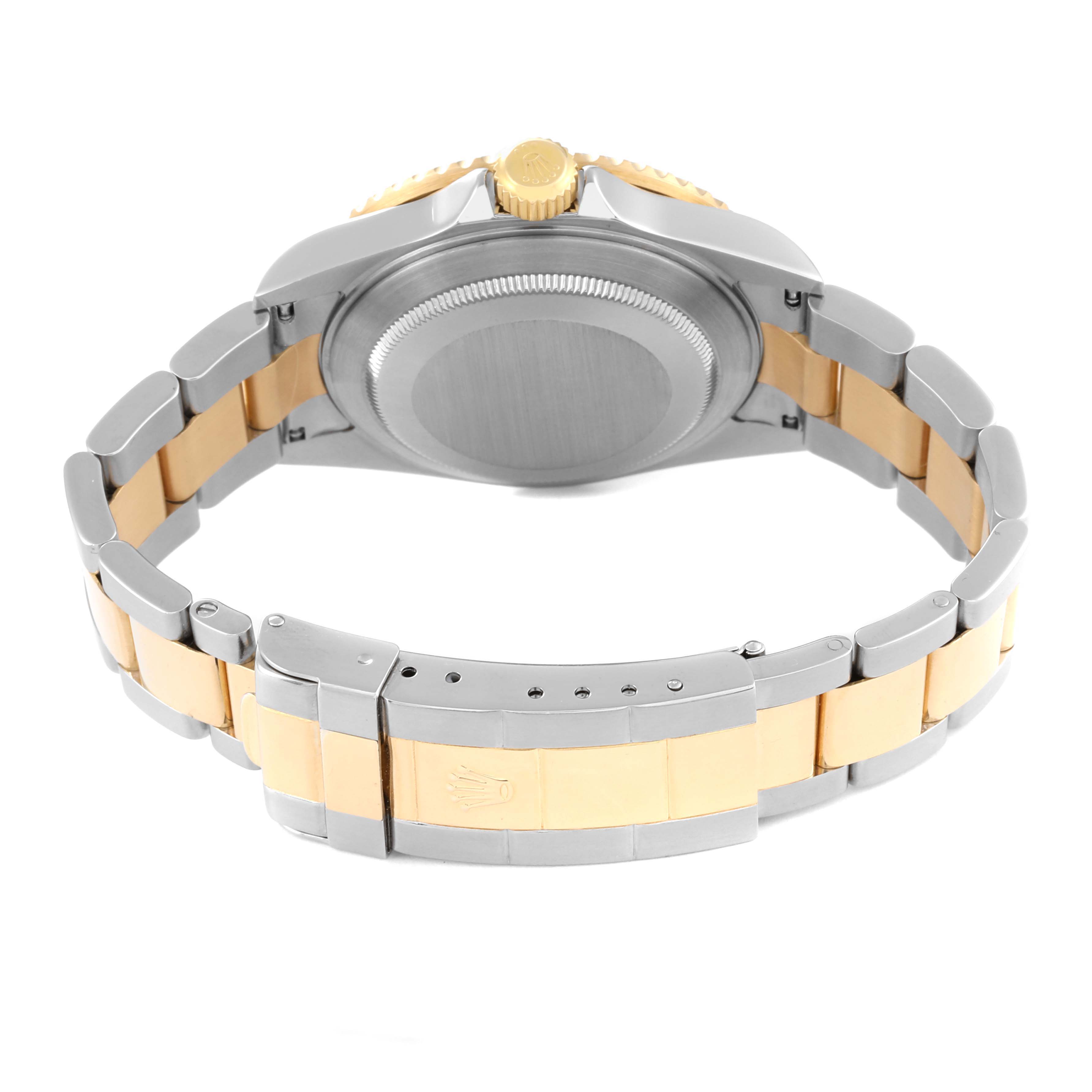This image shows the backside and clasp of a Rolex Submariner 16613 Men's Steel and Gold (two tone) Blue Dial 16613 Men's Steel and Gold (two tone) Blue Dial watch, featuring a two-tone metal bracelet.