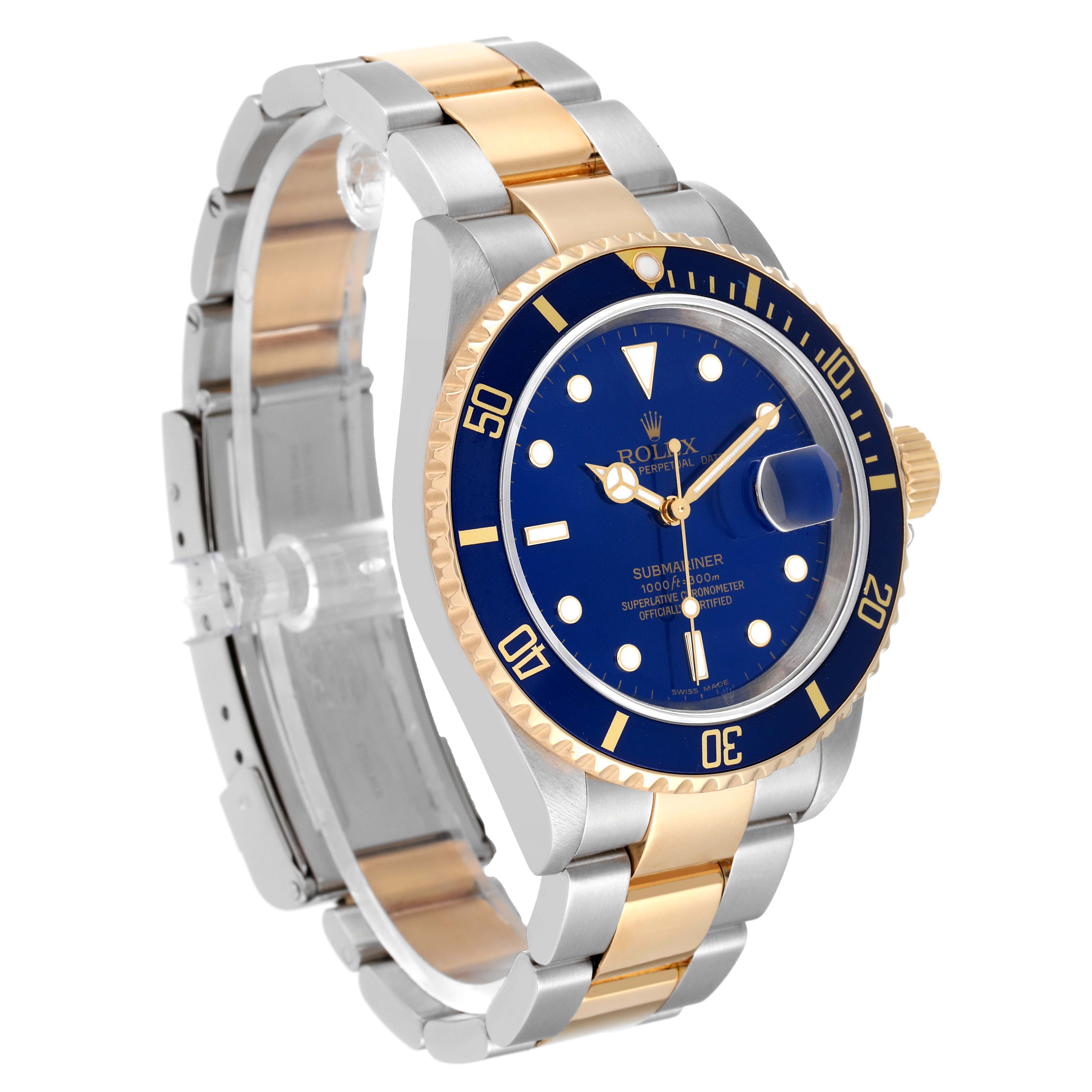 The image shows a Rolex Submariner 16613 Men's Steel and Gold (two tone) Blue Dial 16613 Men's Steel and Gold (two tone) Blue Dial watch at a three-quarter angle, highlighting its blue dial, bezel, and two-tone bracelet.