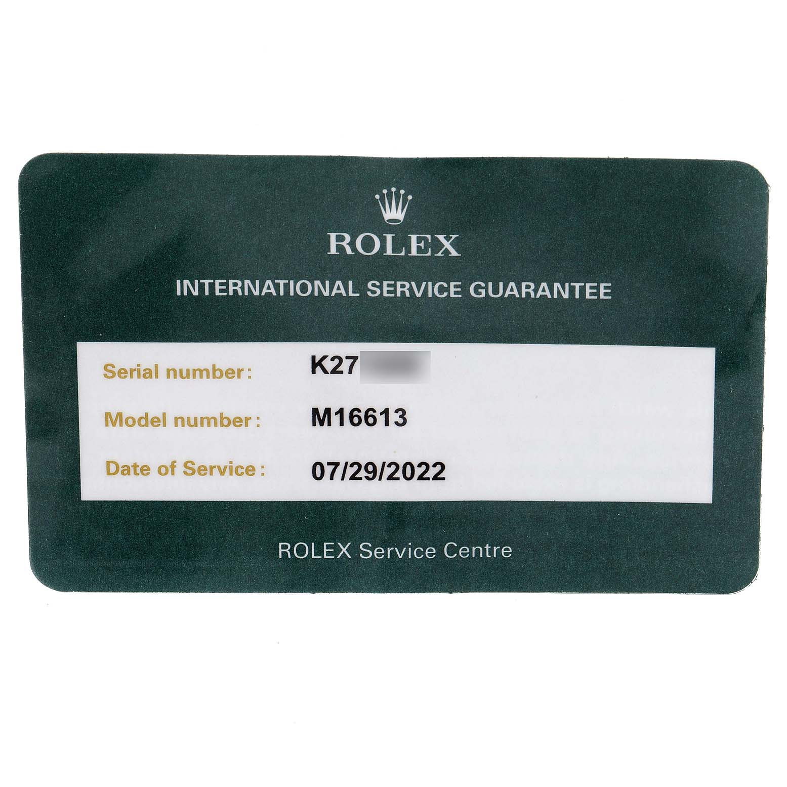 The image shows an International Service Guarantee card for the Rolex Submariner 16613 Men
s Steel and Gold (two tone) Blue Dial 16613 Men
s Steel and Gold (two tone) Blue Dial model M16613.