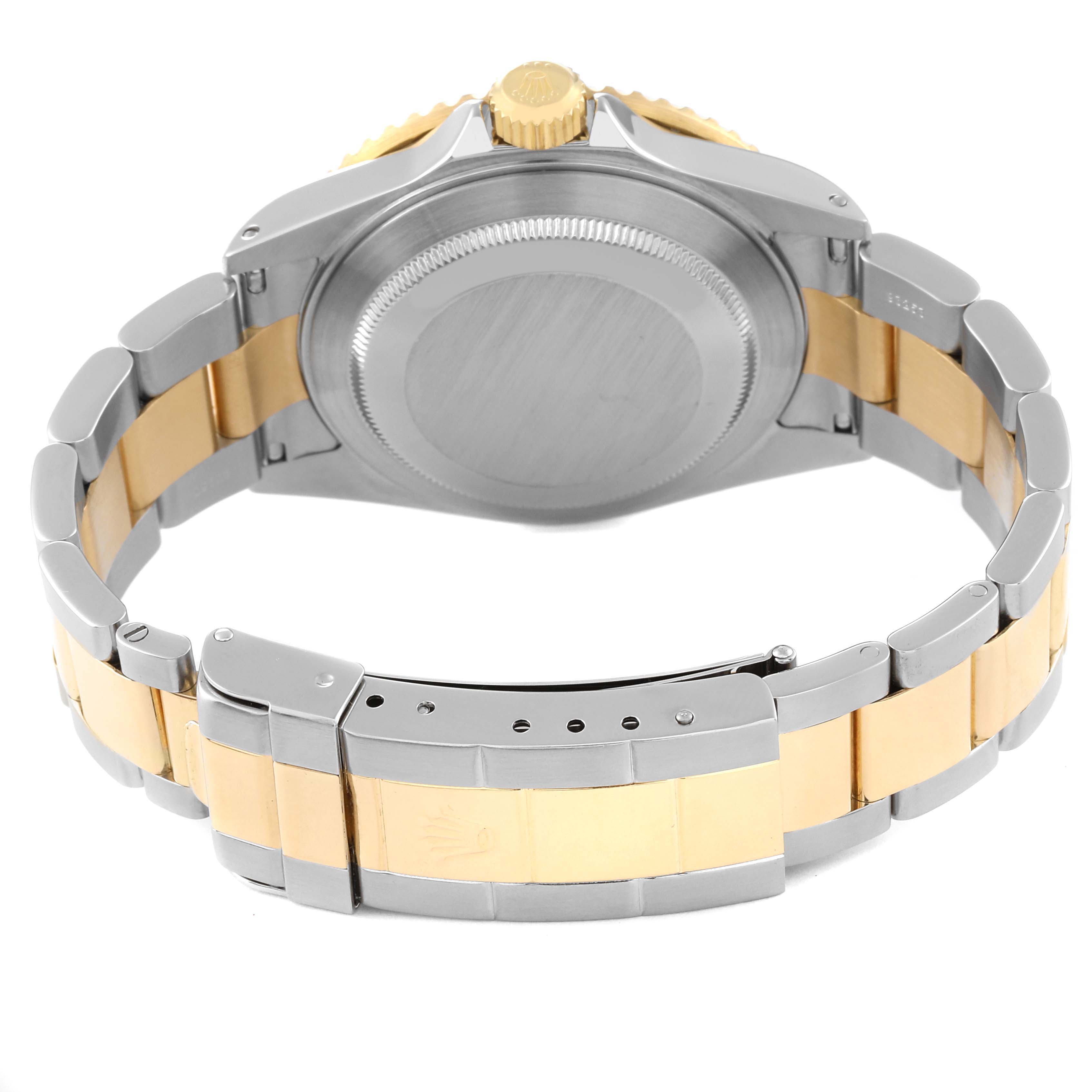 The image shows the back view of a Rolex Submariner 16613 Men's Steel and Gold (two tone) Blue Dial 16613 Men's Steel and Gold (two tone) Blue Dial watch, focusing on the case back and part of the two-tone bracelet.