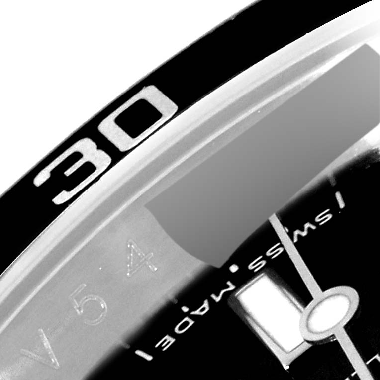The image shows an angled close-up of the 30-minute marker and partial dial details of a Rolex Submariner 16610 Men
s Stainless Steel Black Dial 16610 Men
s Stainless Steel Black Dial watch.