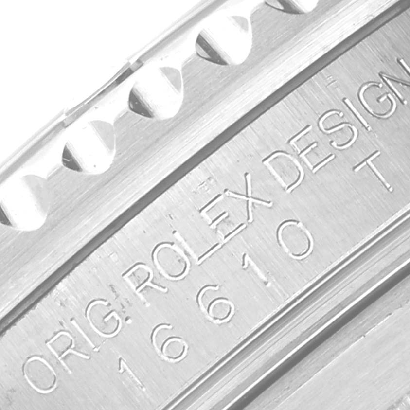 This image shows a close-up angle of the engravings and bezel of the Rolex Submariner 16610 Men
s Stainless Steel Black Dial 16610 Men
s Stainless Steel Black Dial watch, including the model number "16610."