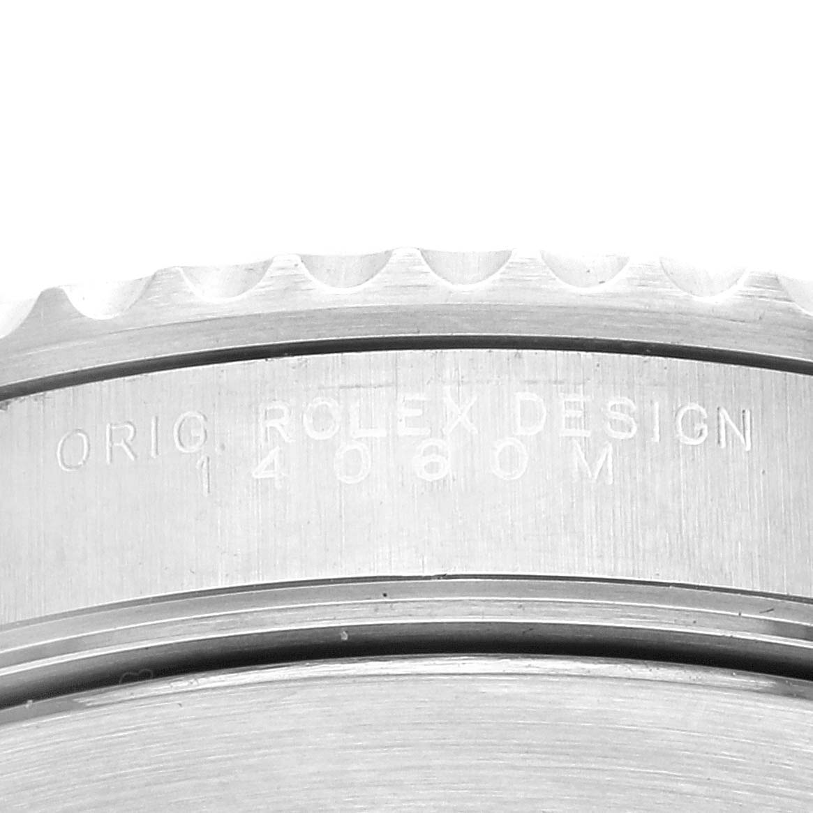 The image shows a close-up of the case side of a Rolex Submariner 14060M Men's Stainless Steel Black Dial 14060M Men's Stainless Steel Black Dial watch, displaying the engraving "ORIG ROLEX DESIGN" and the model number.