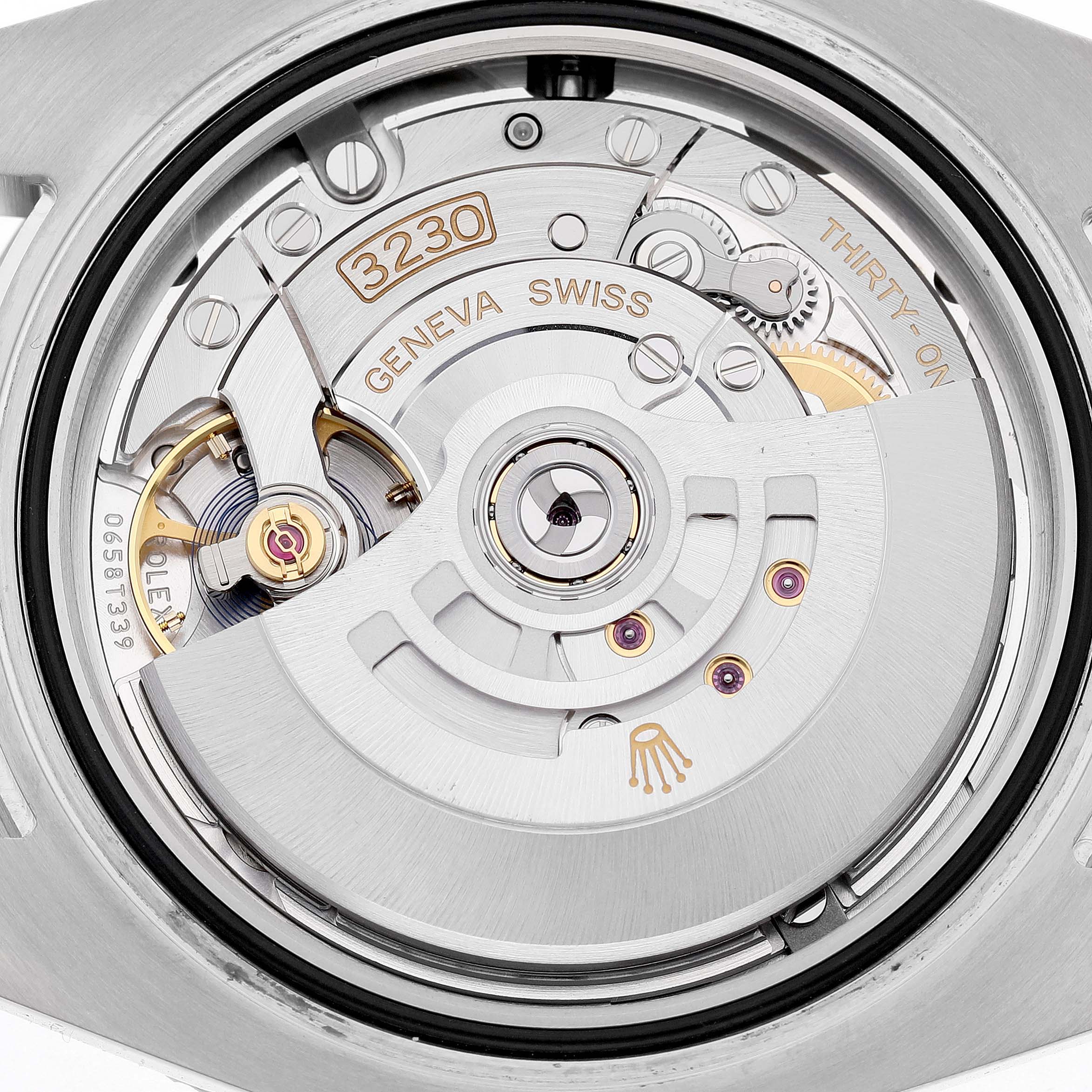 The image shows the movement of a Rolex Submariner M124060-0001 Men's Stainless Steel Black Dial watch, specifically featuring the rotor and intricate gears.