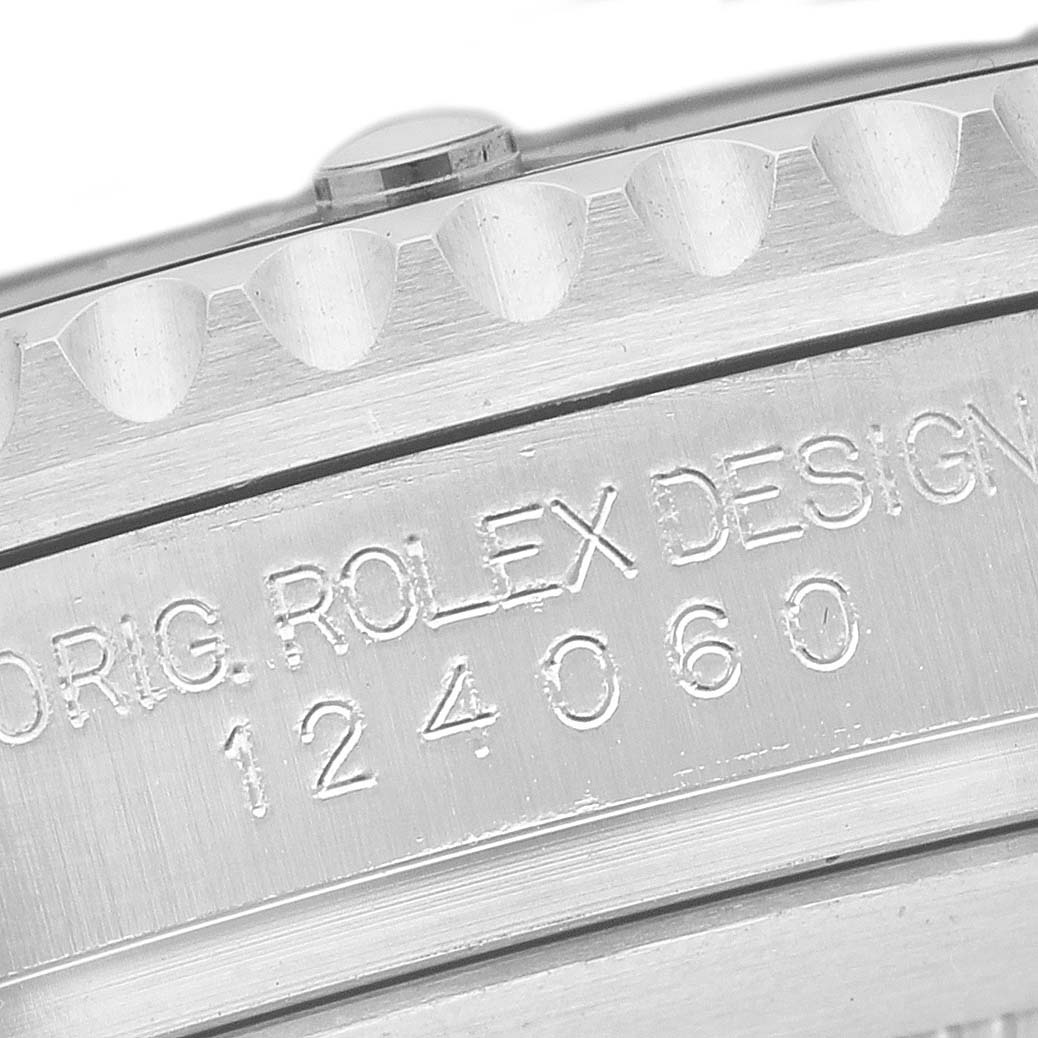 The image shows a close-up of the side of a Rolex Submariner M124060-0001 Men's Stainless Steel Black Dial, displaying the engraved model number.