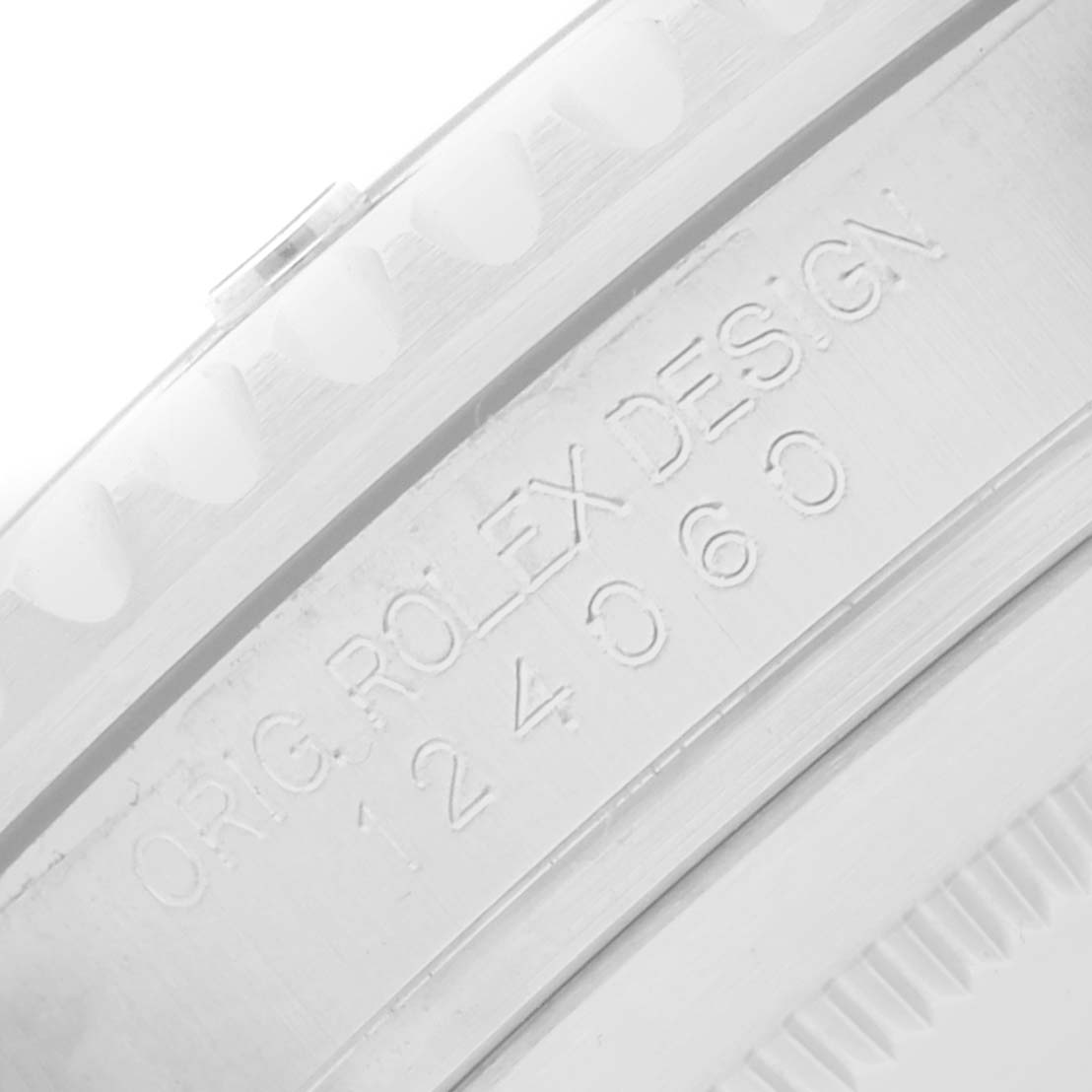 The image shows a close-up of the side engraving on a Rolex Submariner 124060 Men's Stainless Steel Black Dial watch, highlighting the serial and model number.