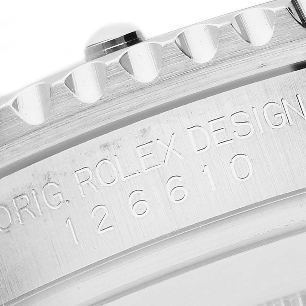 The image shows a close-up of the Rolex Submariner 126610 Men's Stainless Steel Black Dial's case edge and bezel, highlighting the engraved model number and branding.