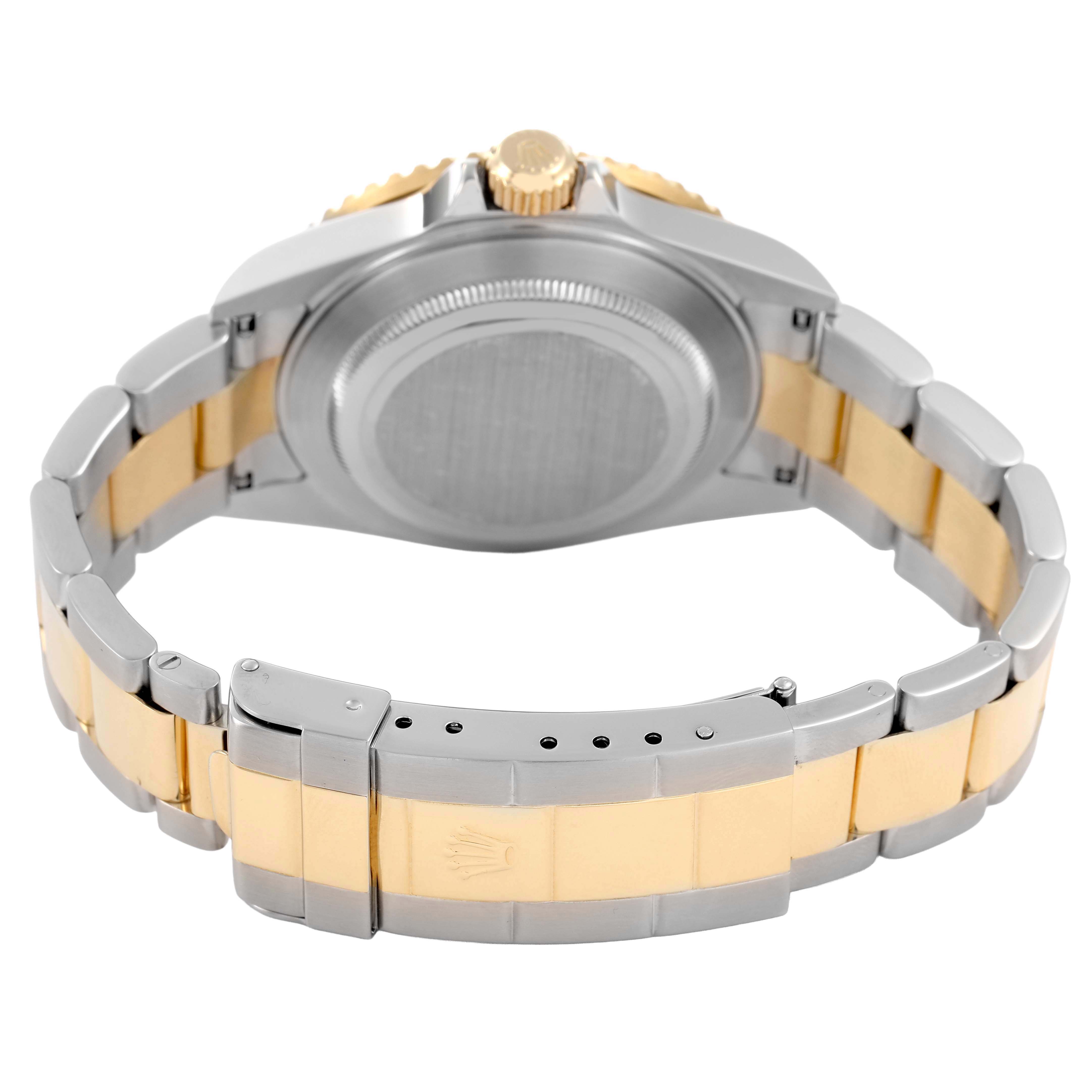 The image shows the back of a Rolex Submariner 16613 Men's Steel and Gold (two tone) Black Dial, highlighting the case back, bracelet, and clasp.
