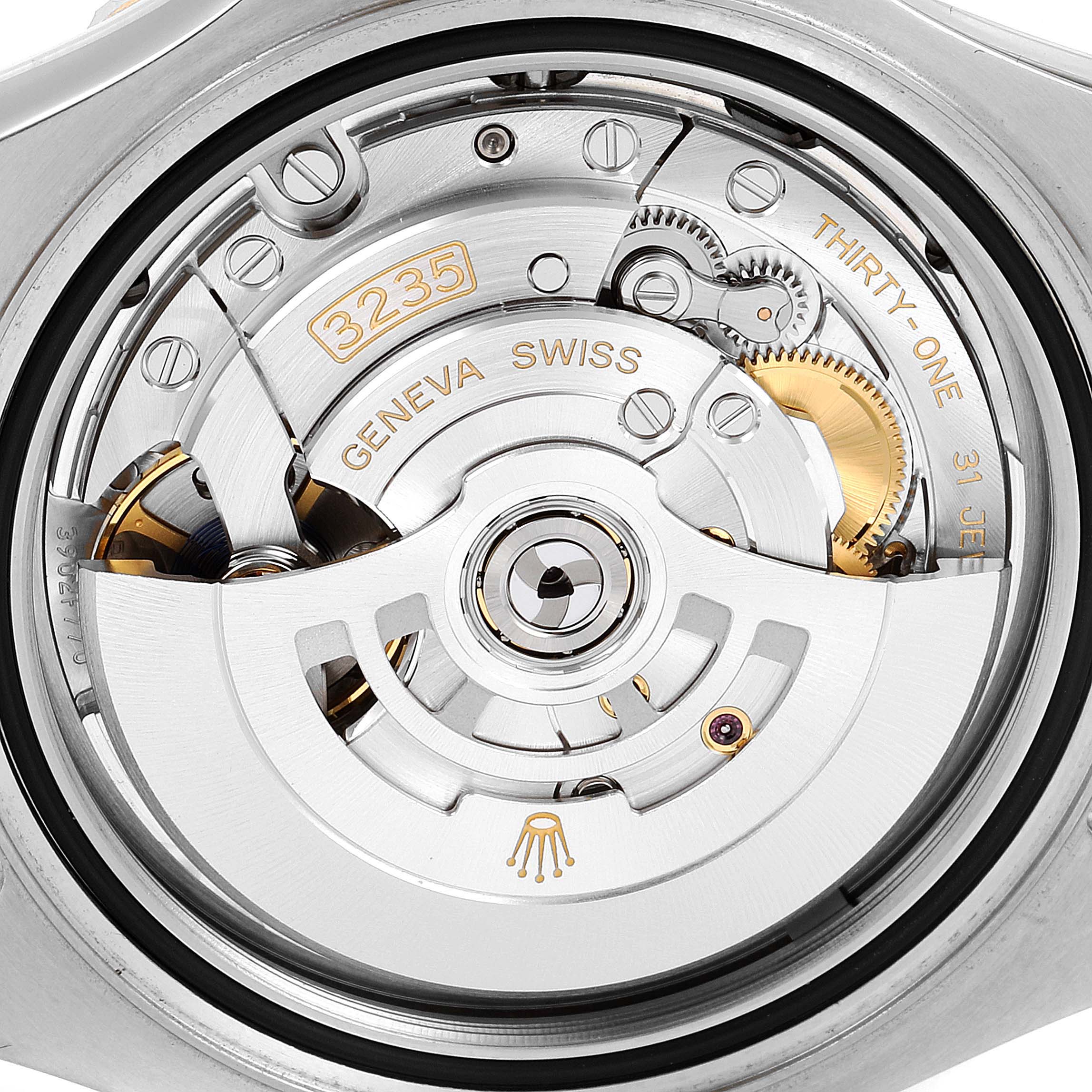 The image shows the movement mechanism of a Rolex Yacht-Master 126621 Men
s Steel and Gold (two tone) Black Dial 126621 Men
s Steel and Gold (two tone) Black Dial watch from a rear angle.