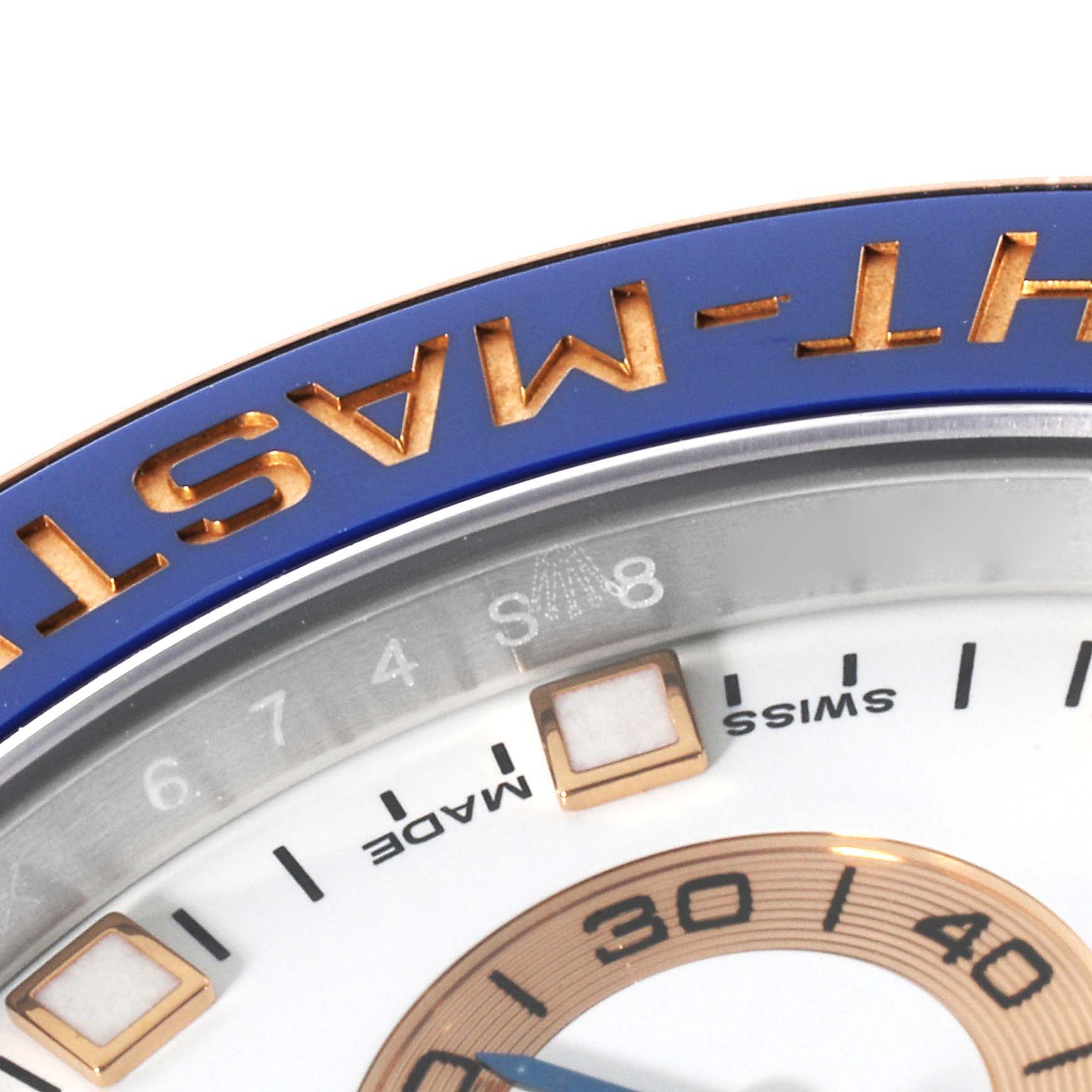 This close-up image shows the bezel and part of the dial of a Rolex Yacht-Master 116681 Men's Steel and Gold (two tone) White Dial 116681 Men's Steel and Gold (two tone) White Dial watch.